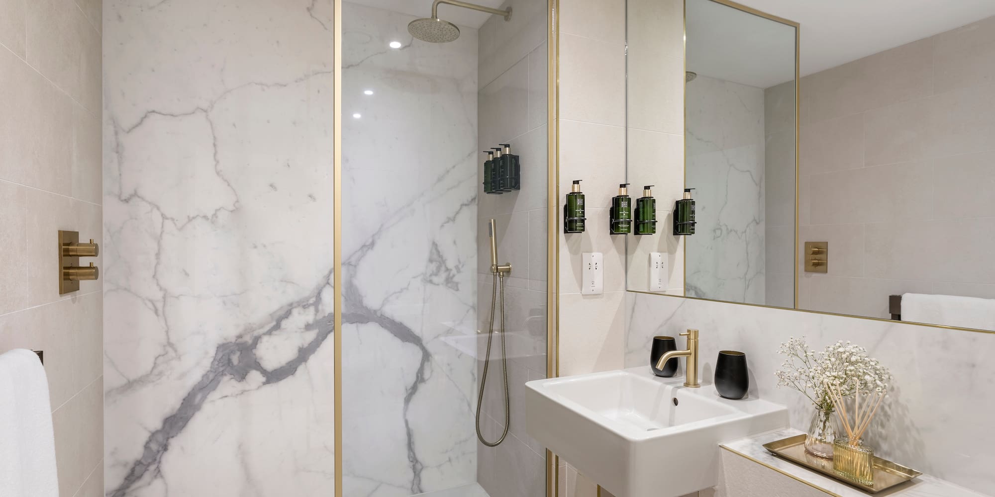 a bathroom with a shower and sink