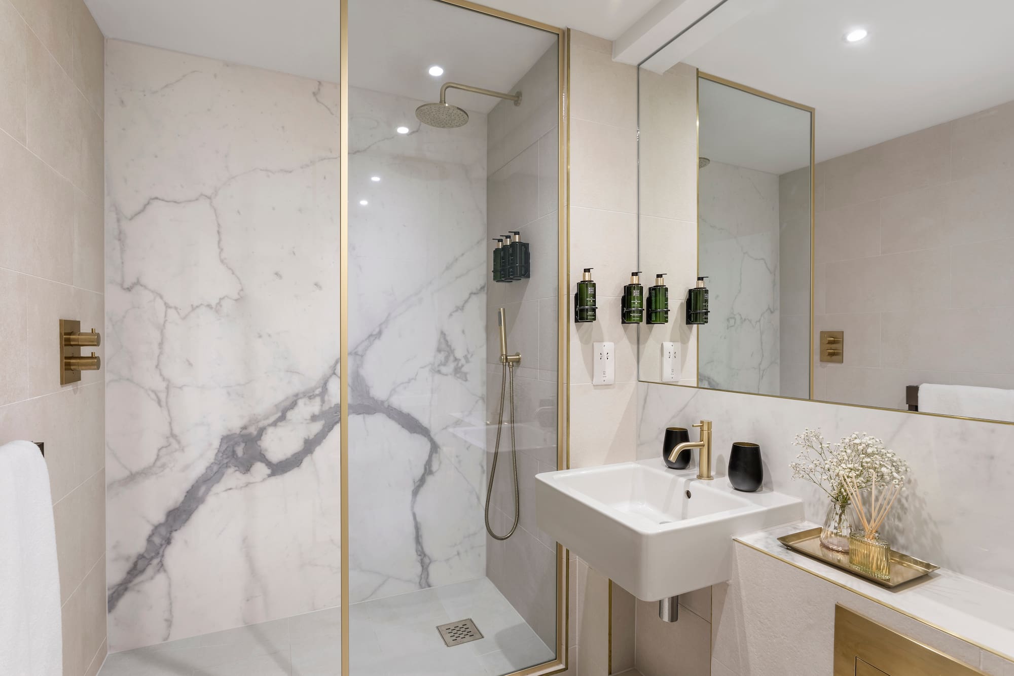 a bathroom with a shower and sink