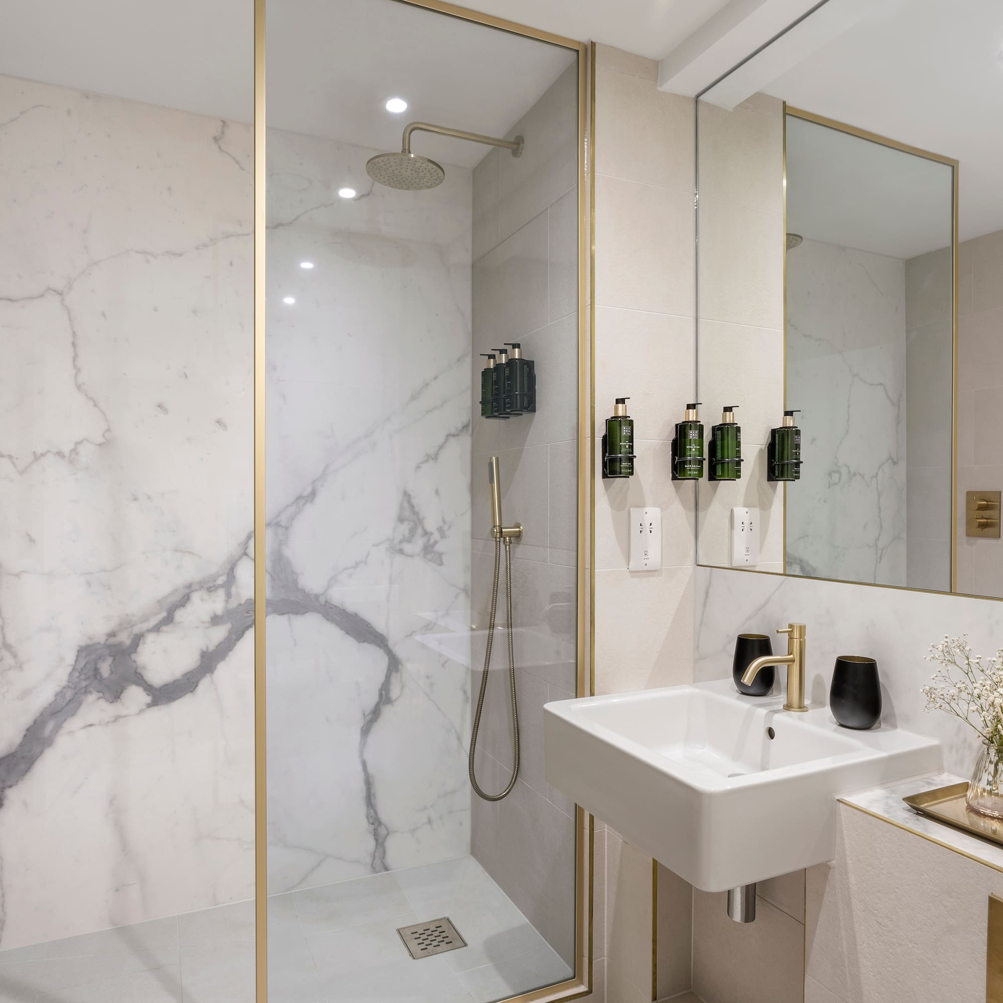 a bathroom with a shower and sink