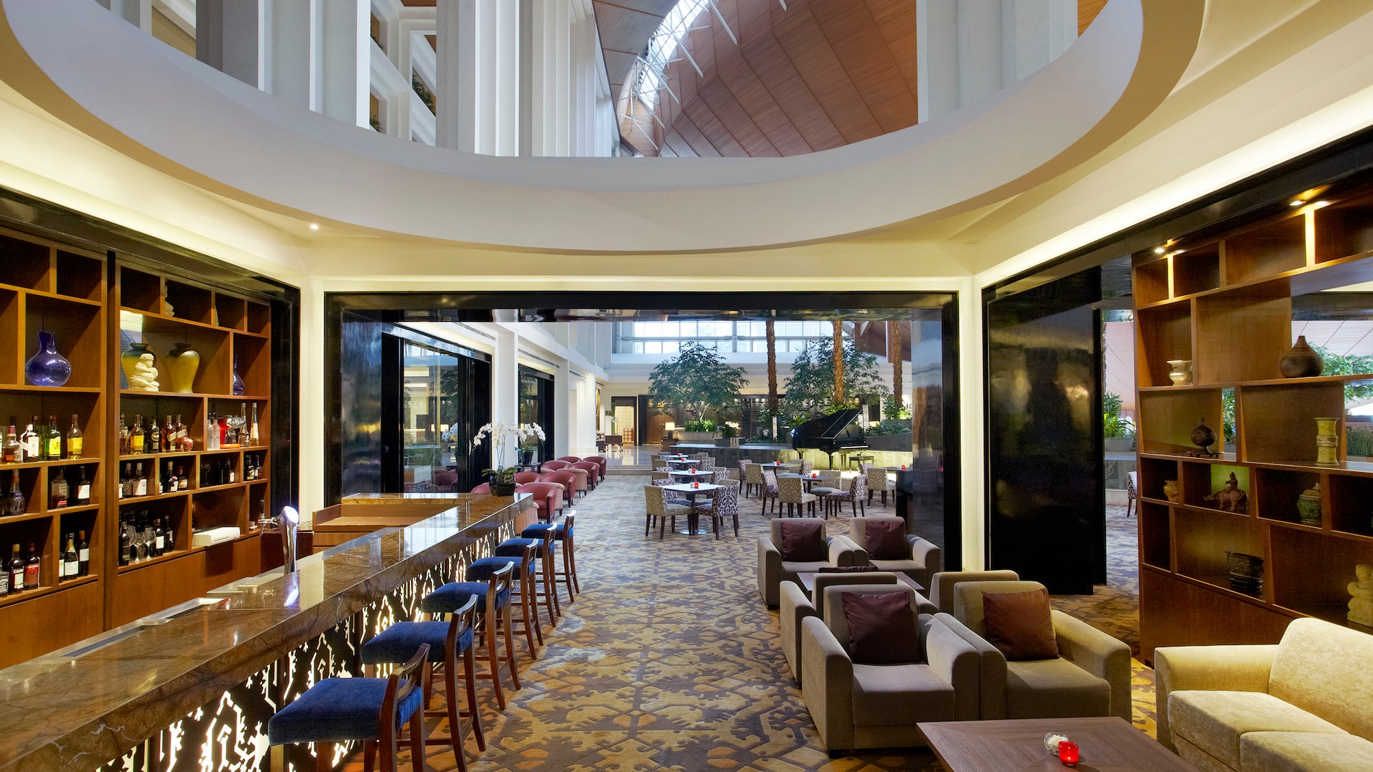 a room with a bar and chairs