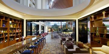 a room with a bar and chairs