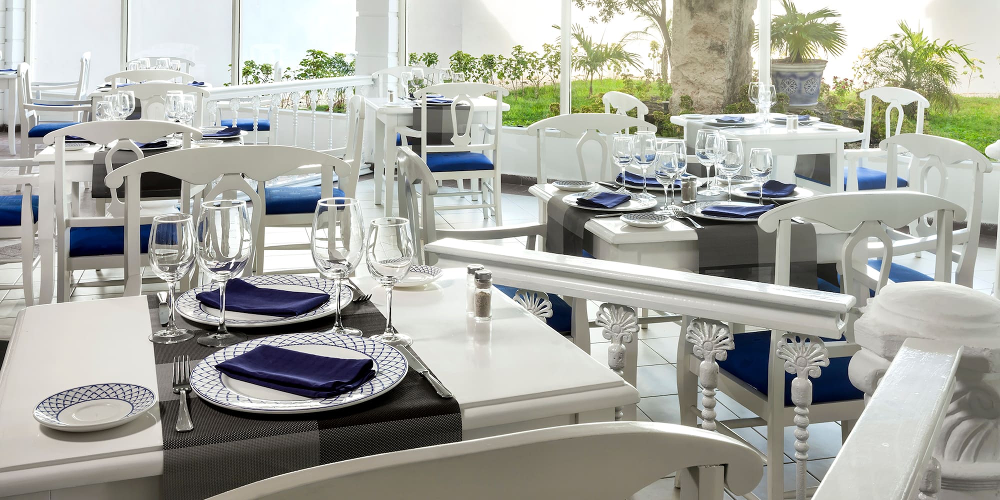 a restaurant with tables and chairs