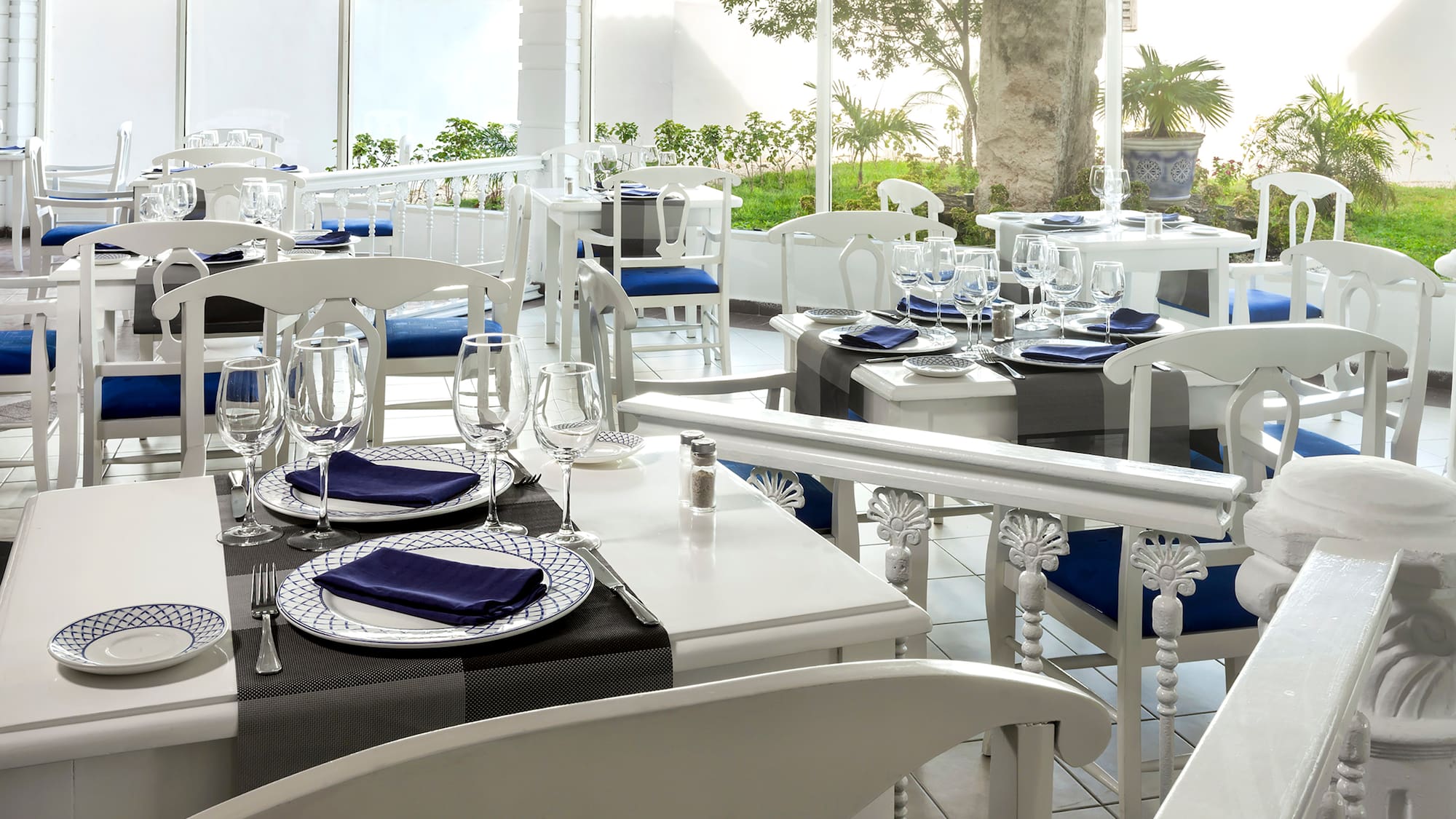 a restaurant with tables and chairs