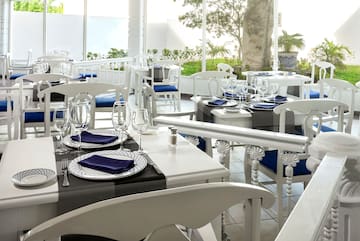 a restaurant with tables and chairs