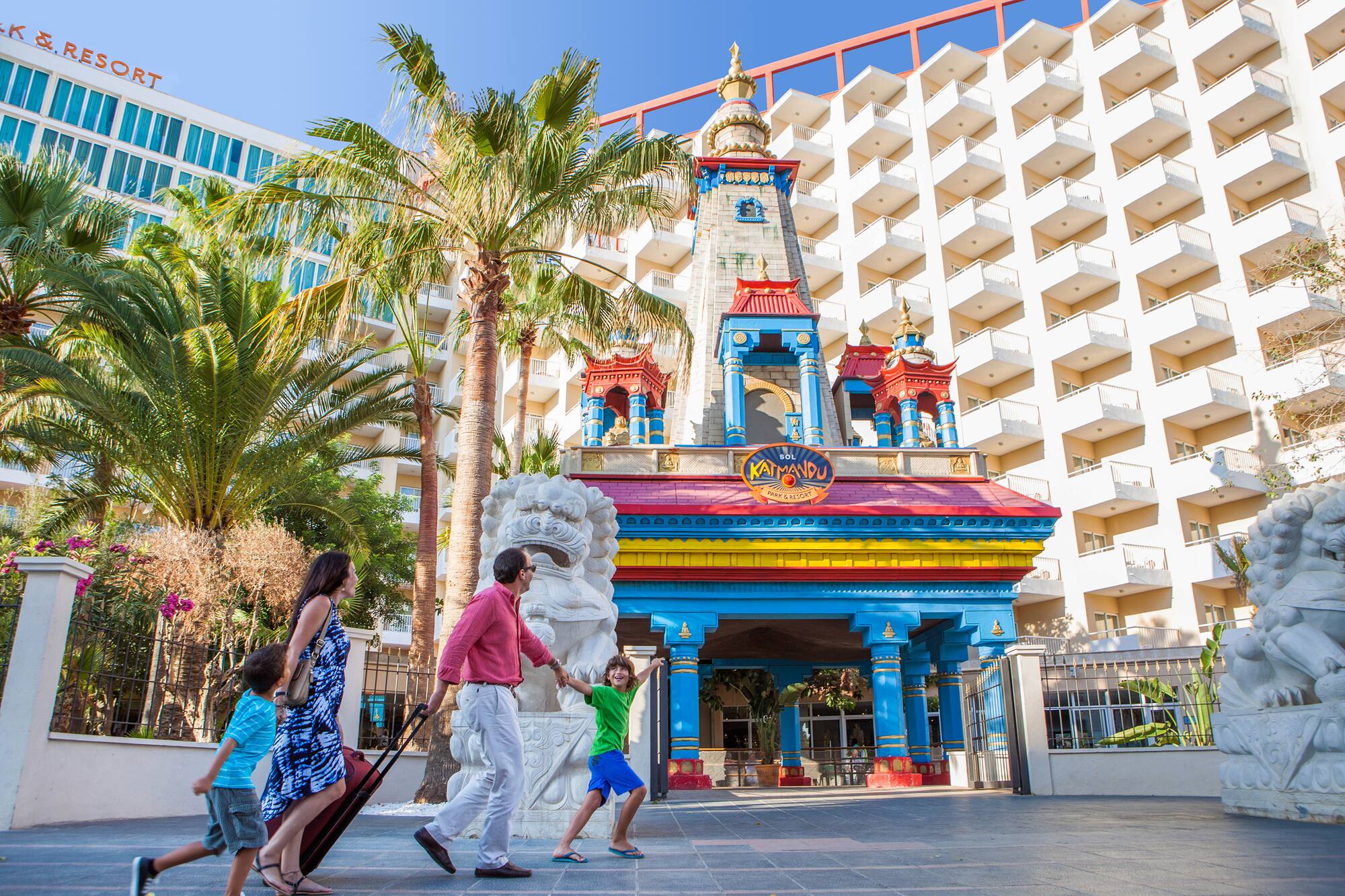 a group of people walking in front of a building