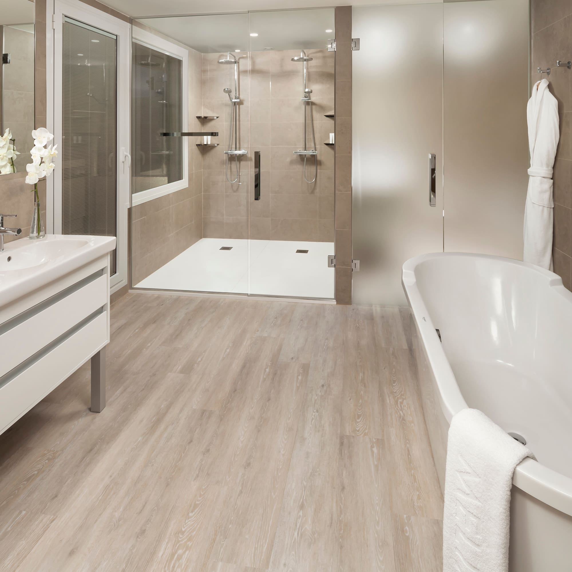 a bathroom with a tub and shower