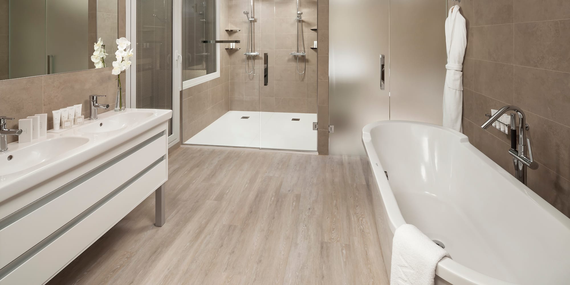 a bathroom with a tub and shower