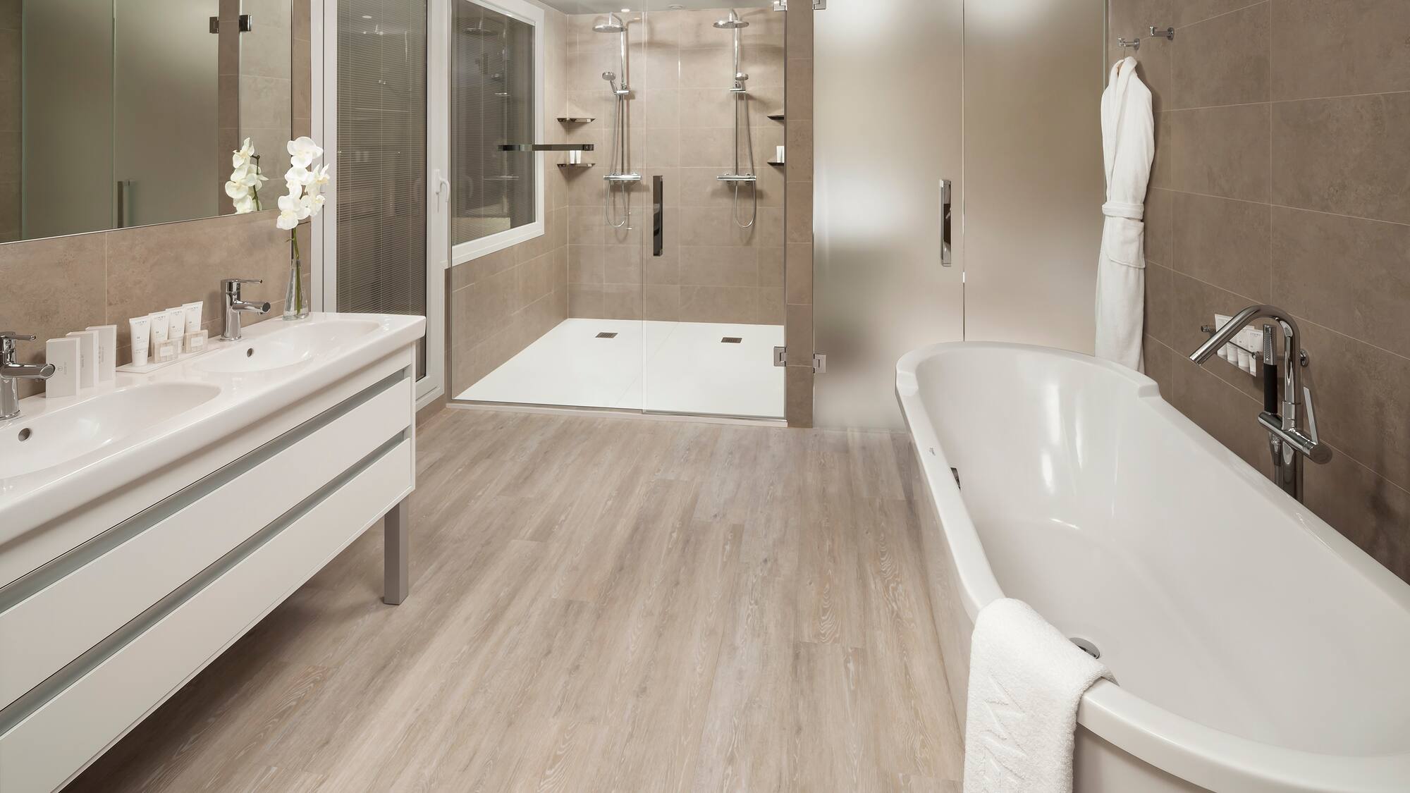 a bathroom with a tub and shower