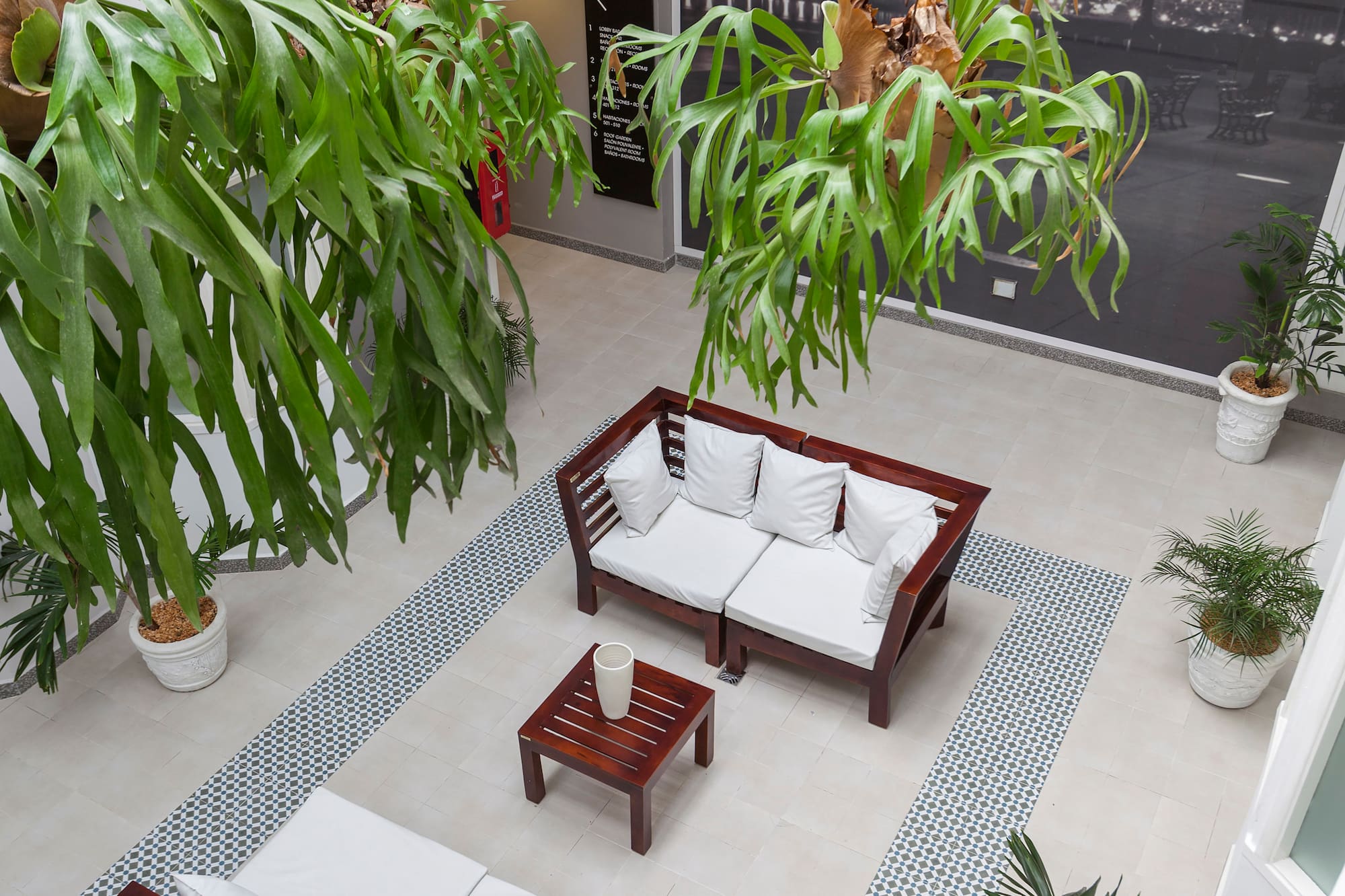 a room with a couch and a table and chairs