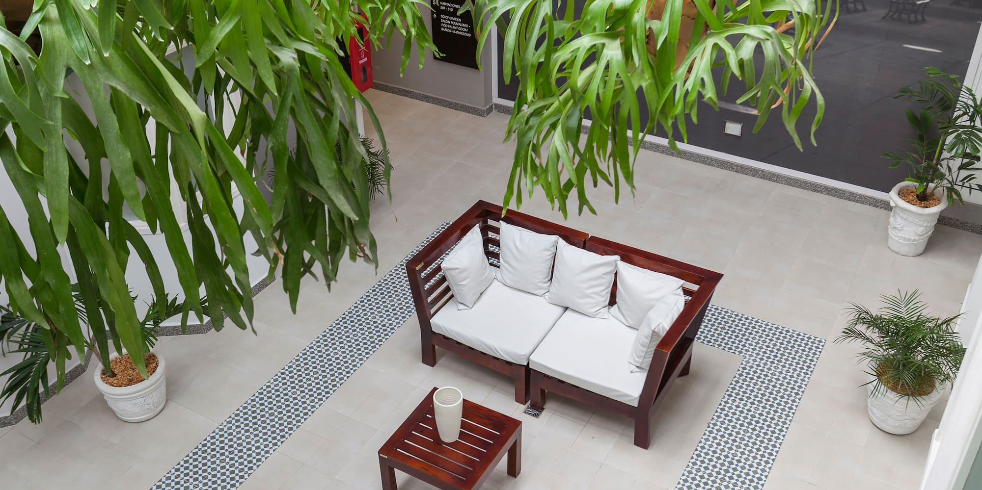 a room with a couch and a table and chairs