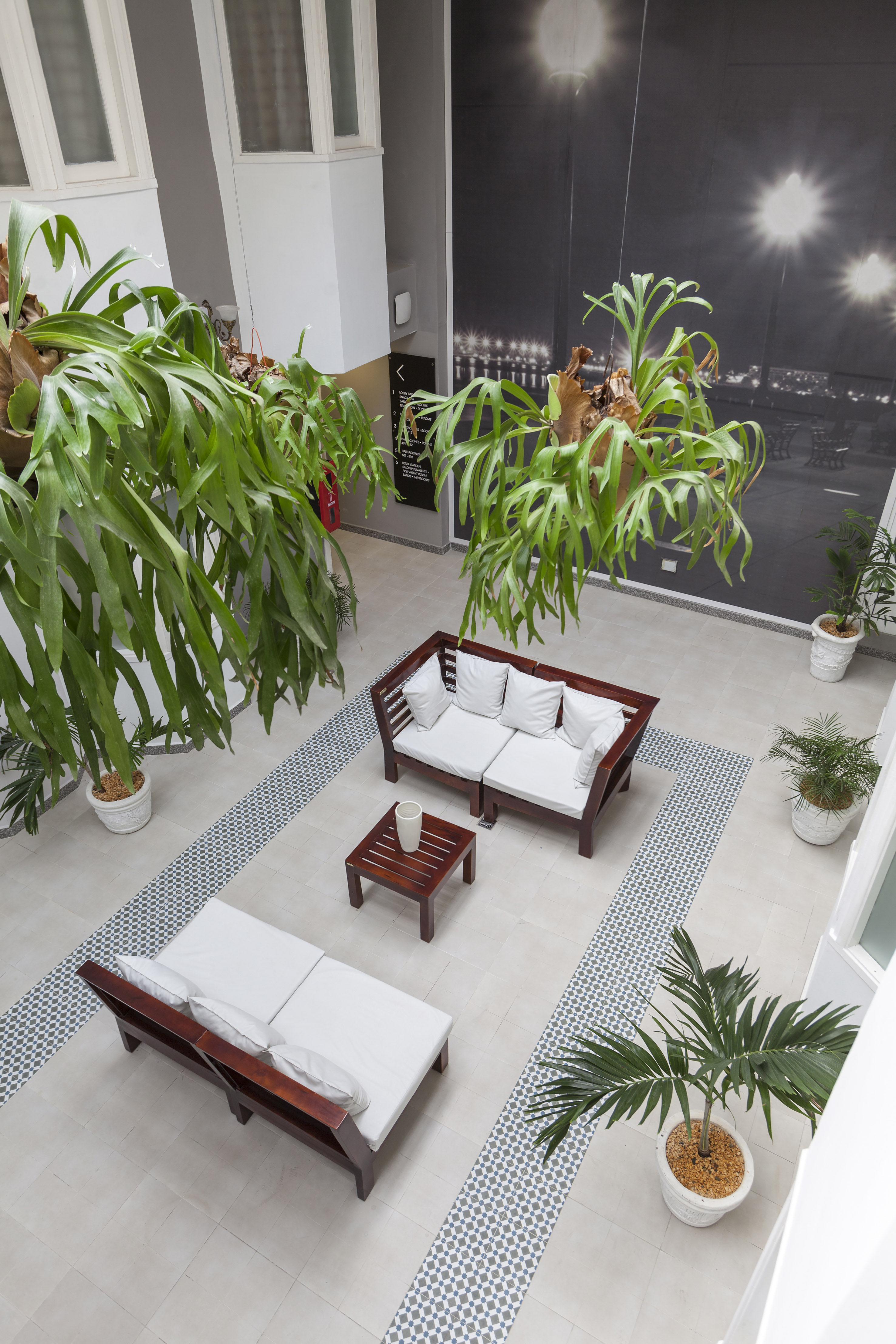 a room with a couch and a table and chairs