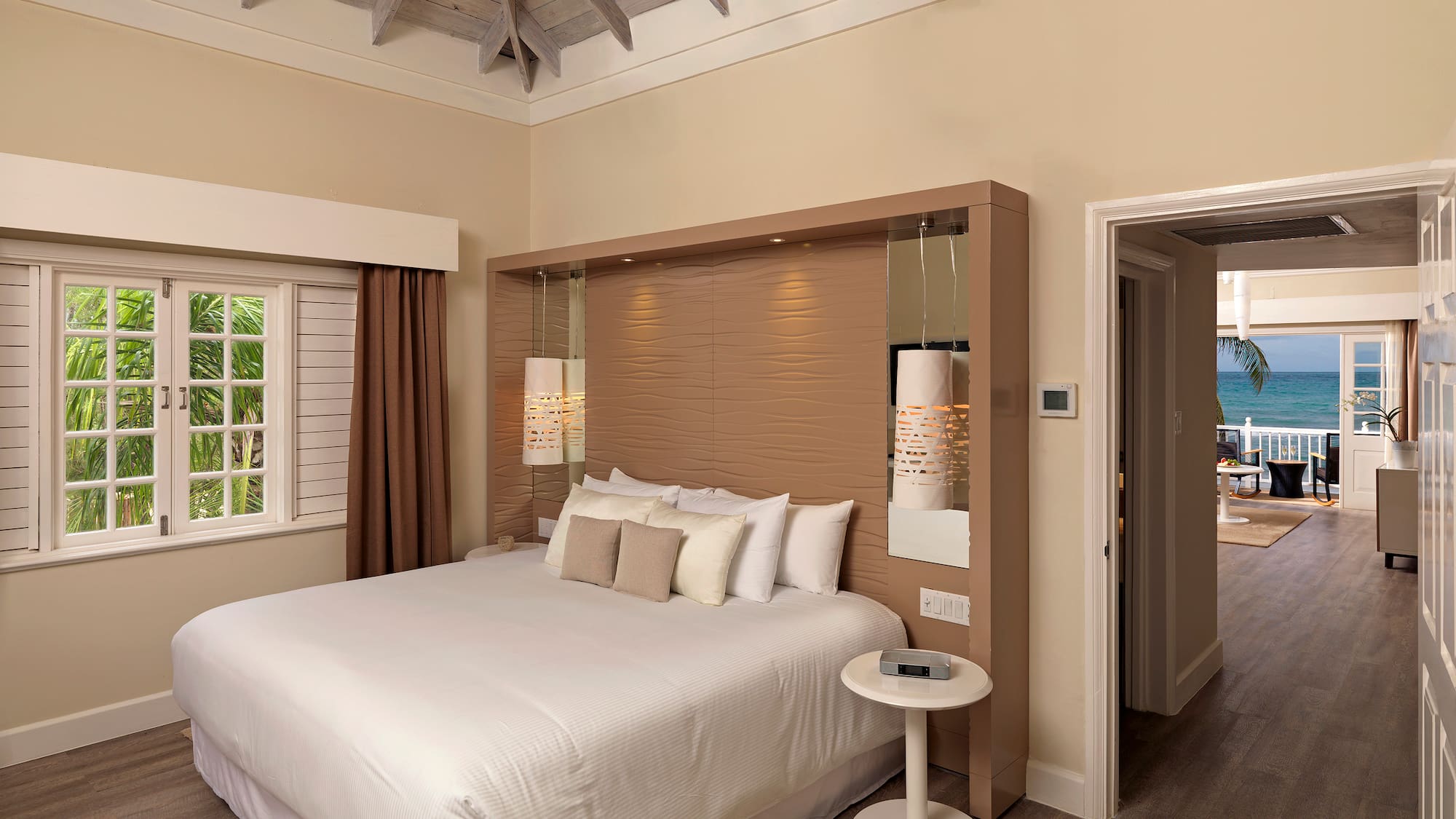 a bedroom with a bed and a wood floor