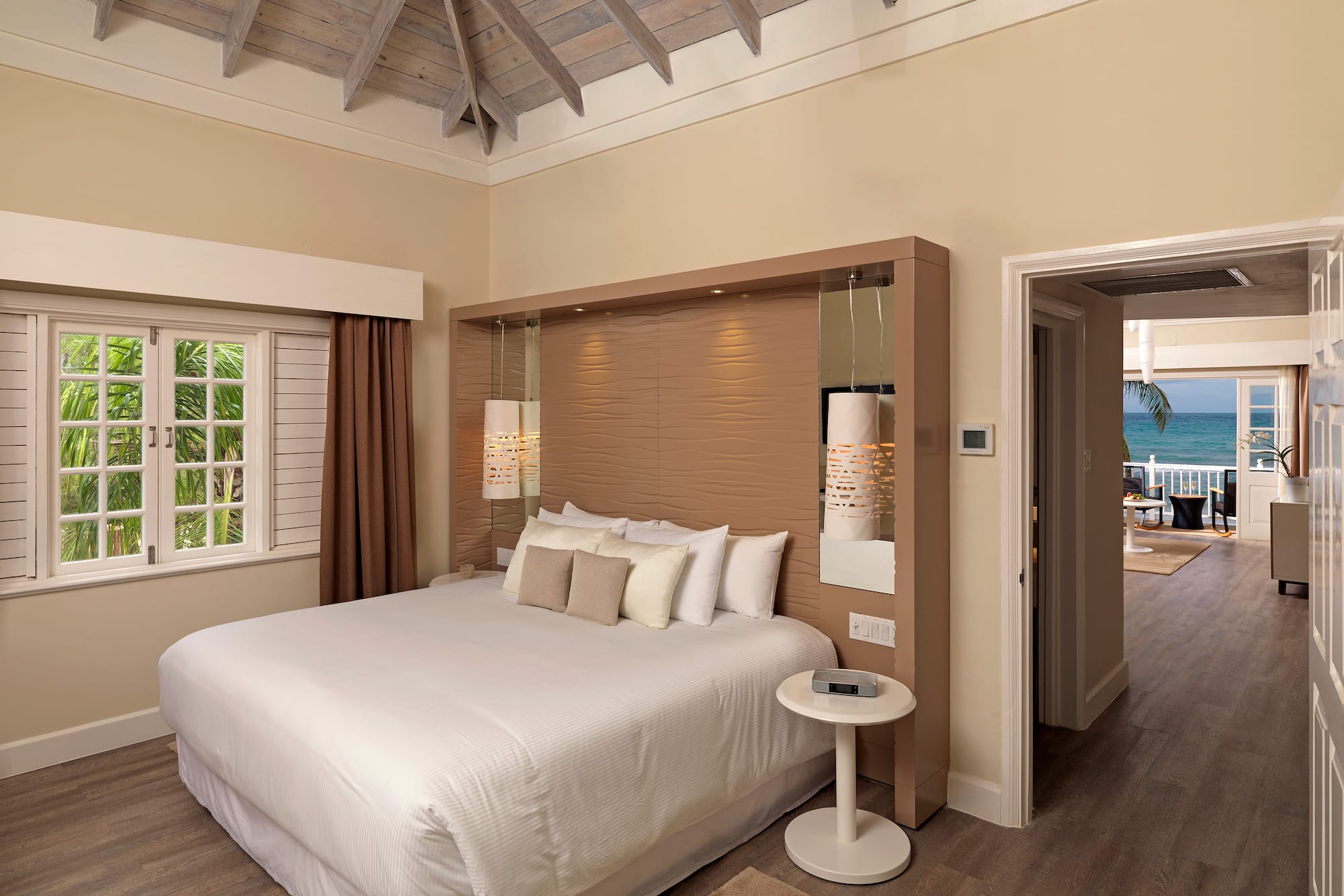 a bedroom with a bed and a wood floor