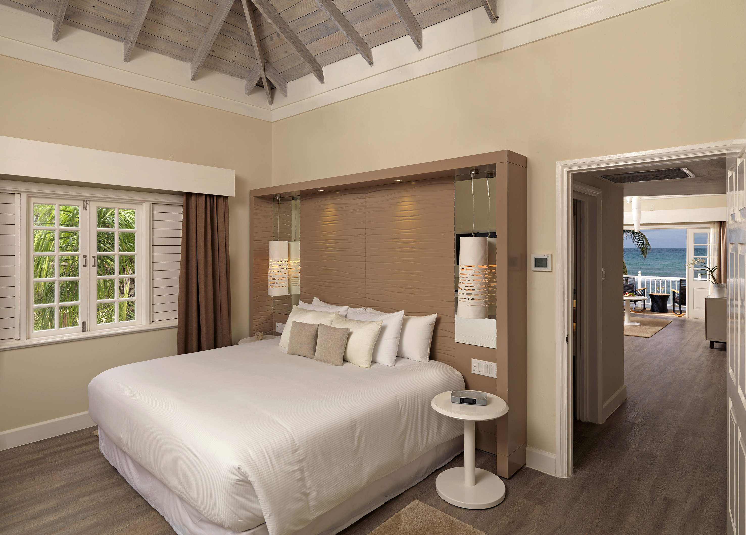 a bedroom with a bed and a wood floor