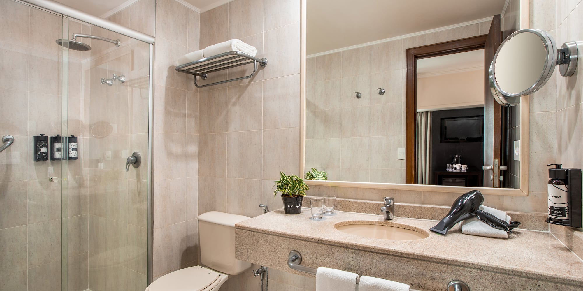 a bathroom with a shower and sink