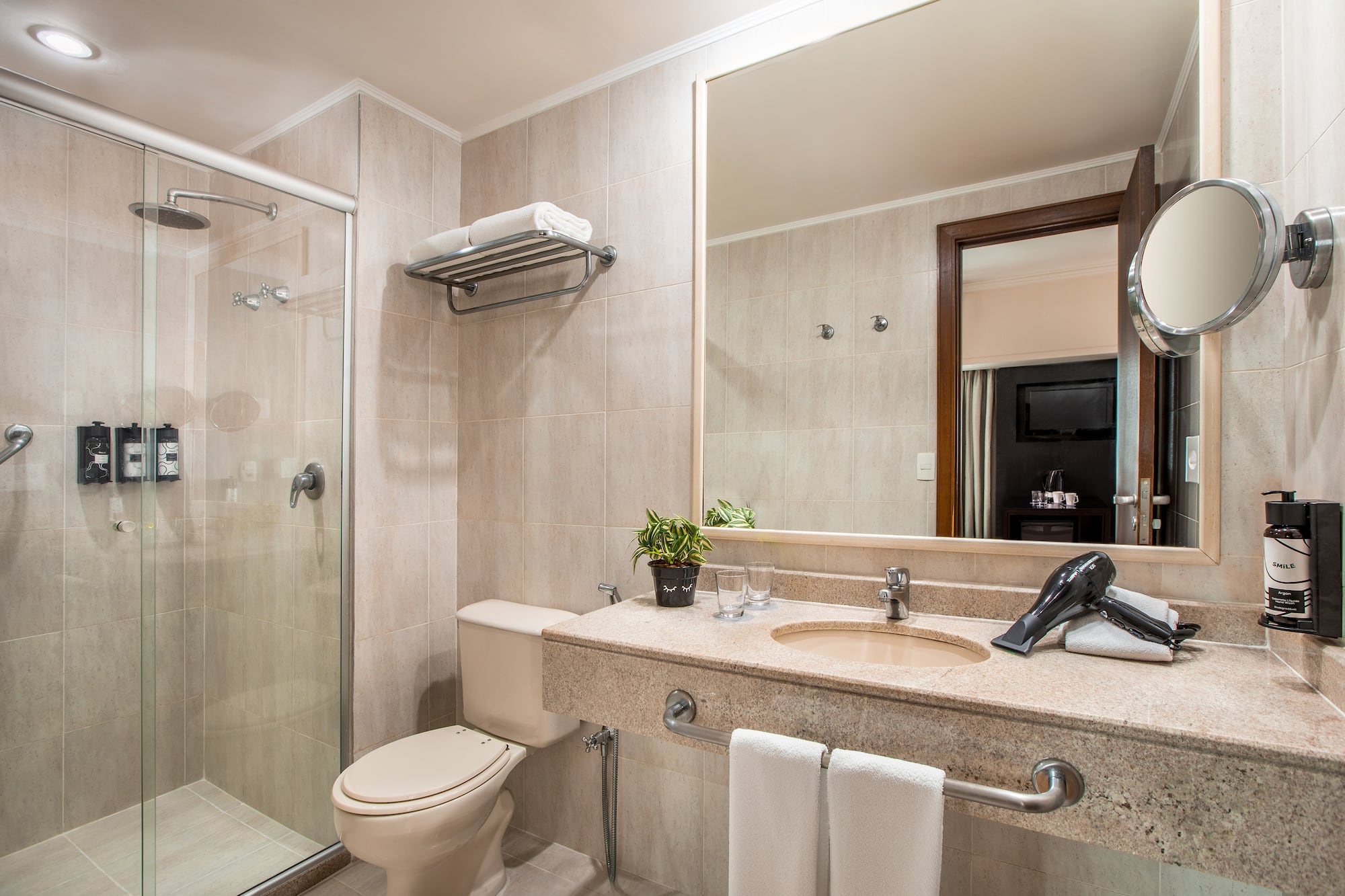 a bathroom with a shower and sink