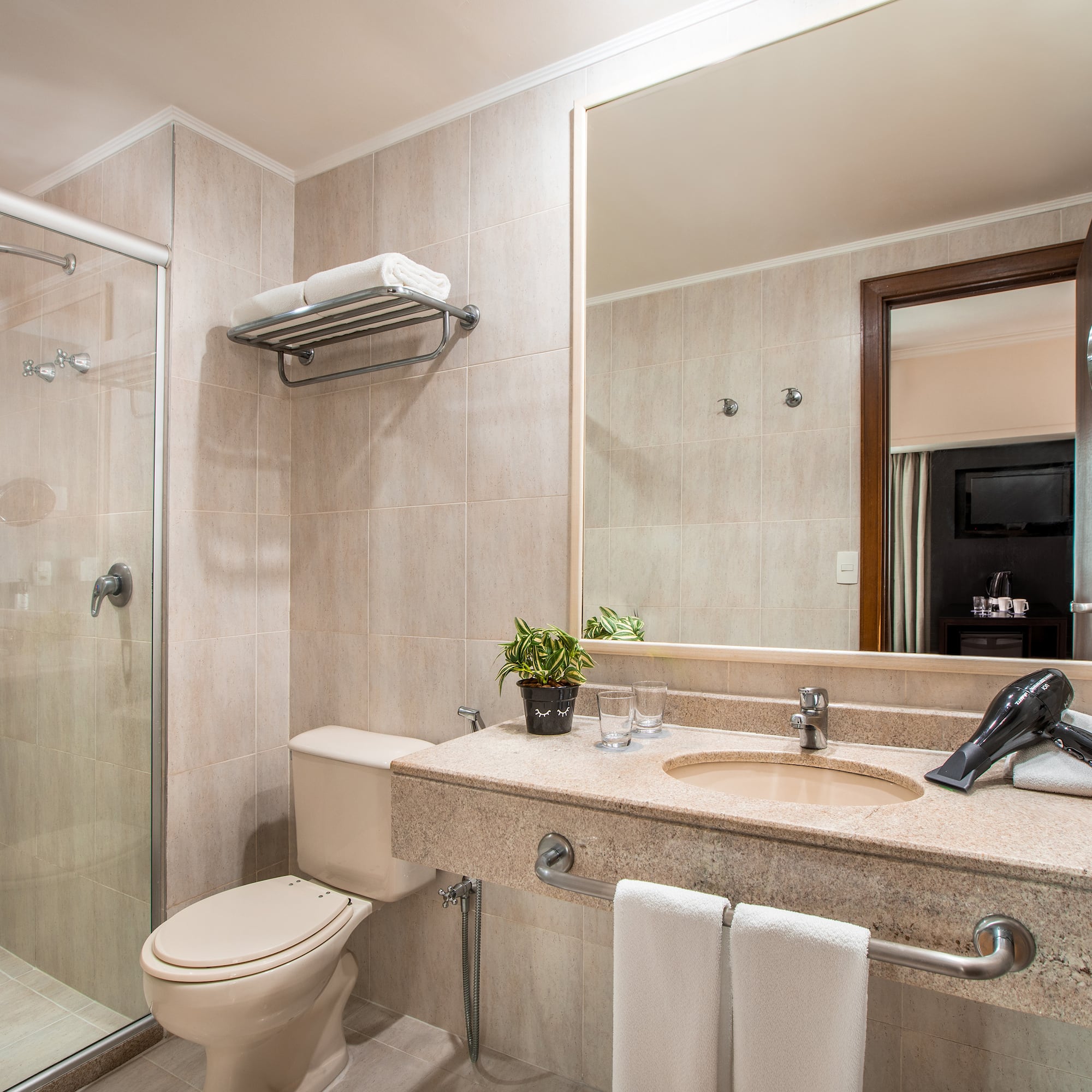 a bathroom with a shower and sink