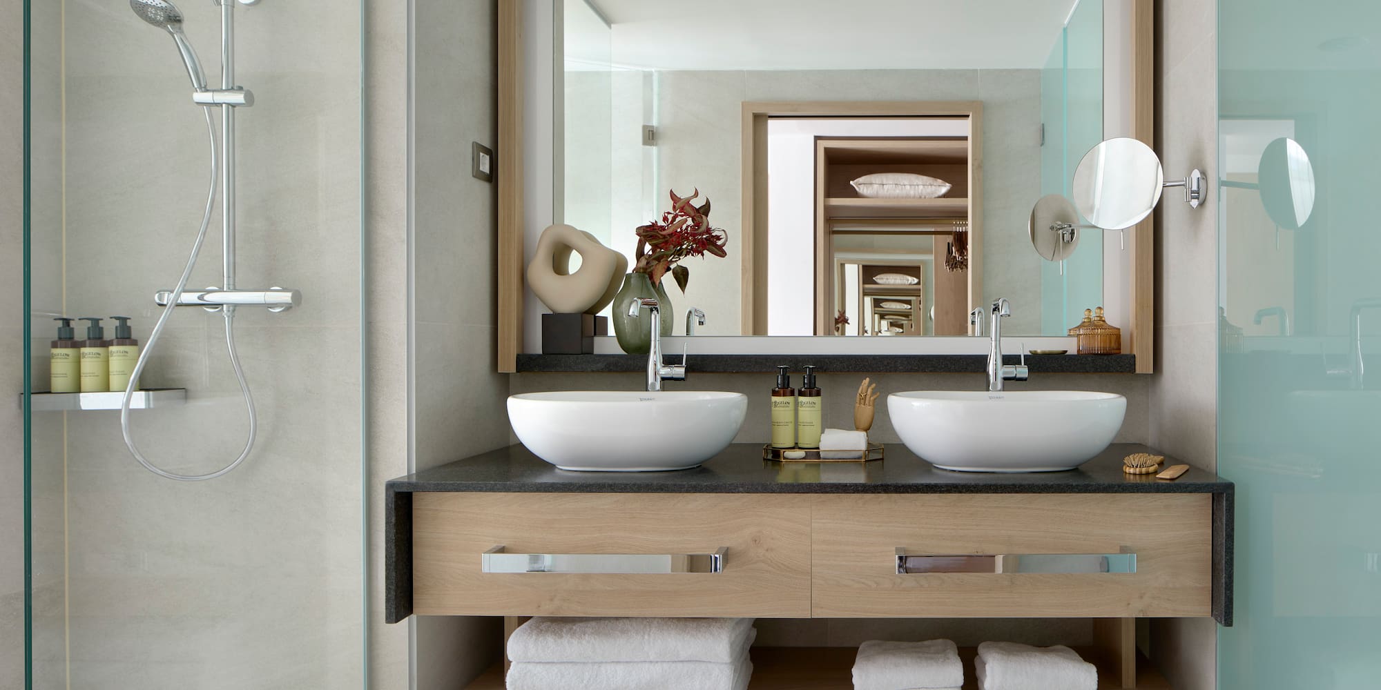 a bathroom with a mirror and two sinks