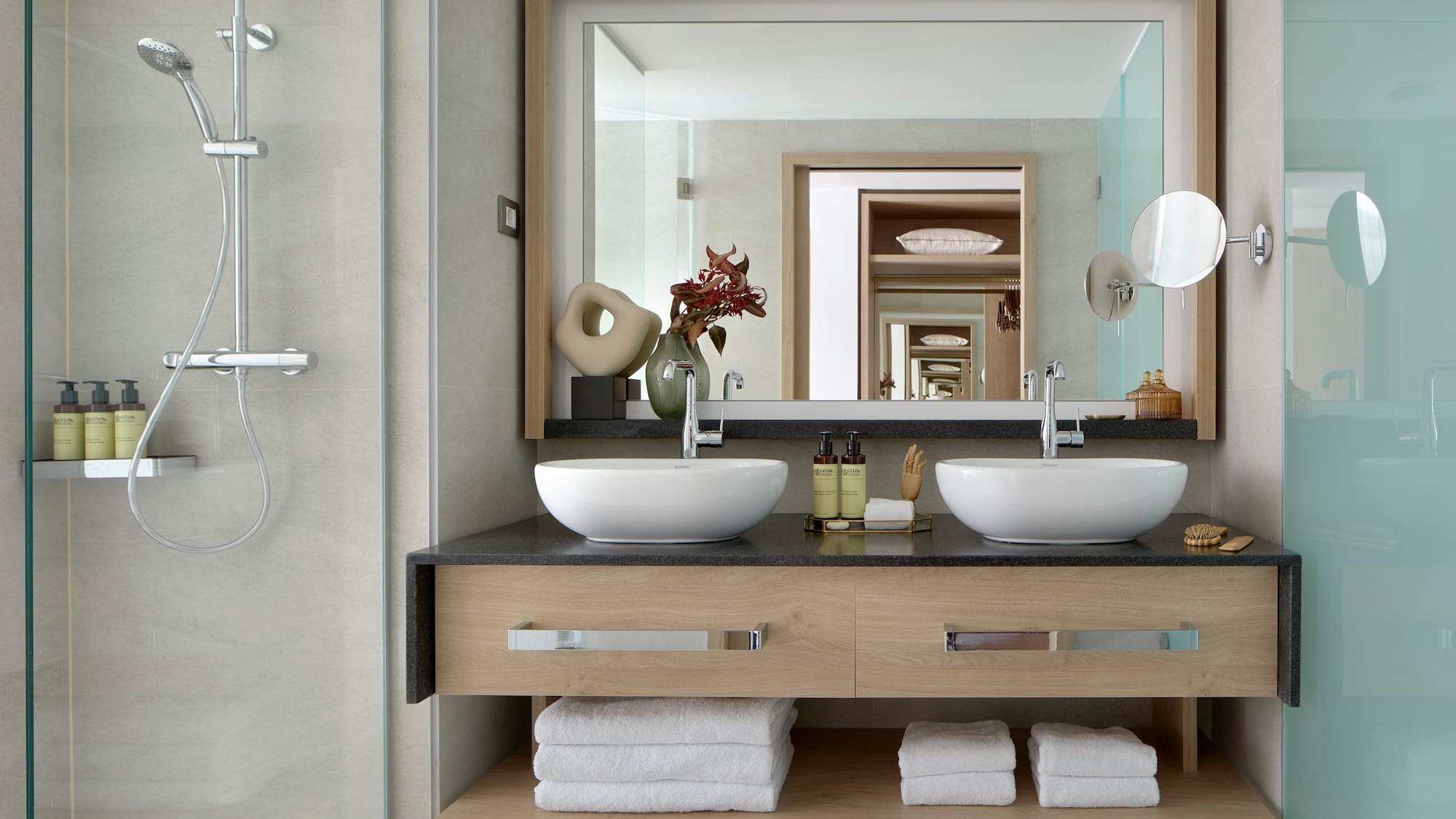 a bathroom with a mirror and two sinks