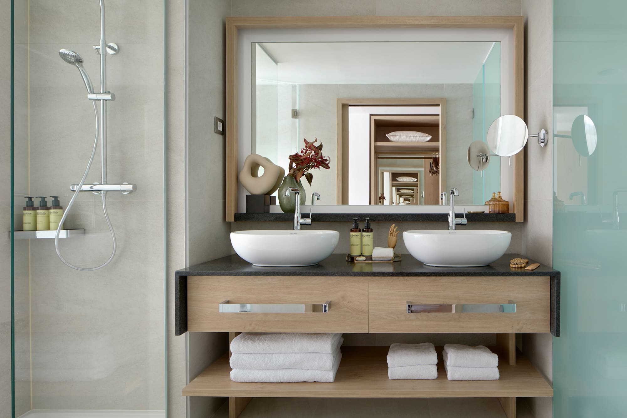 a bathroom with a mirror and two sinks