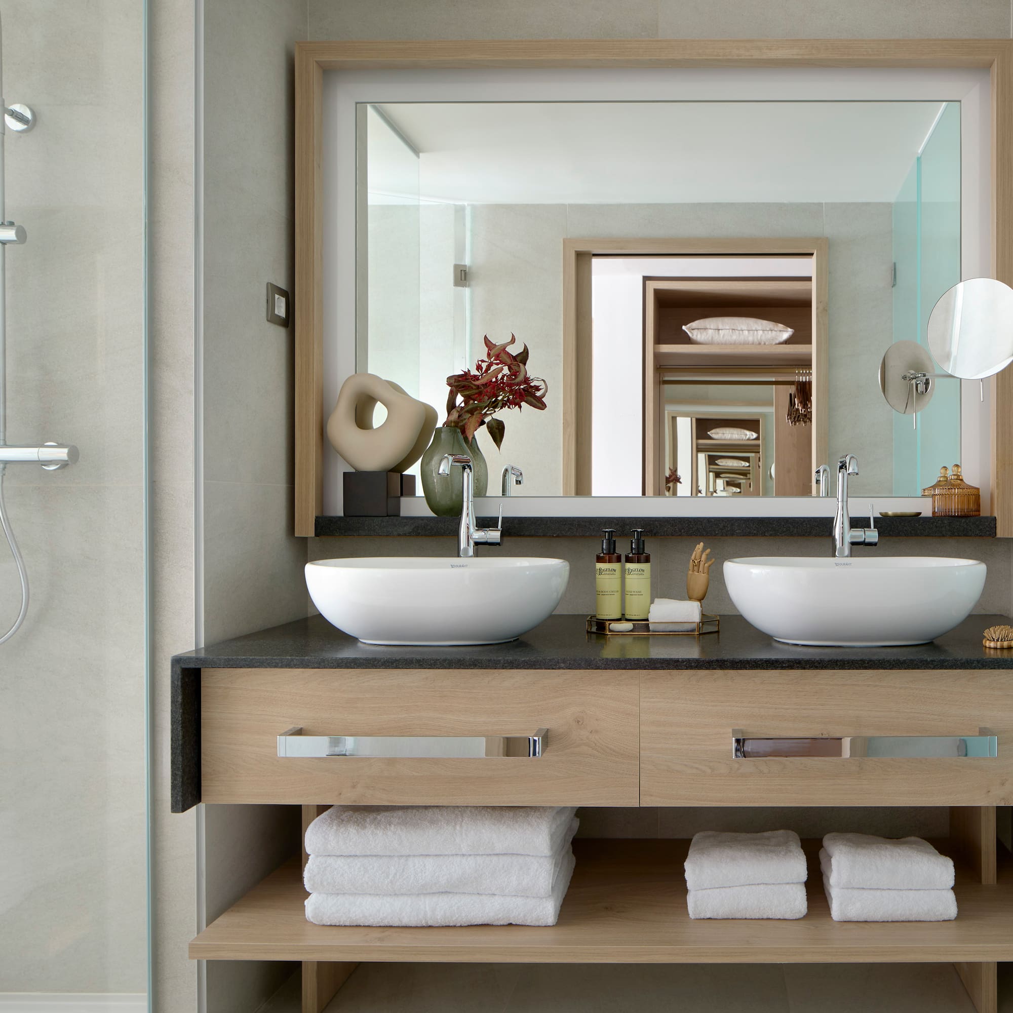 a bathroom with a mirror and two sinks