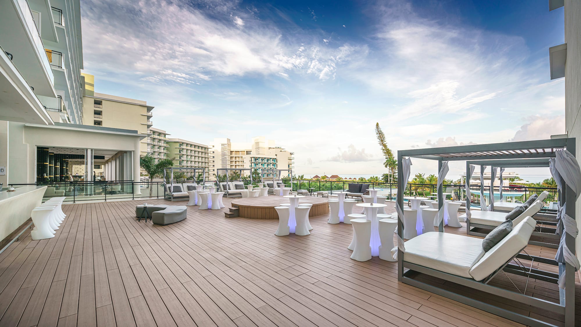 a deck with tables and chairs on it