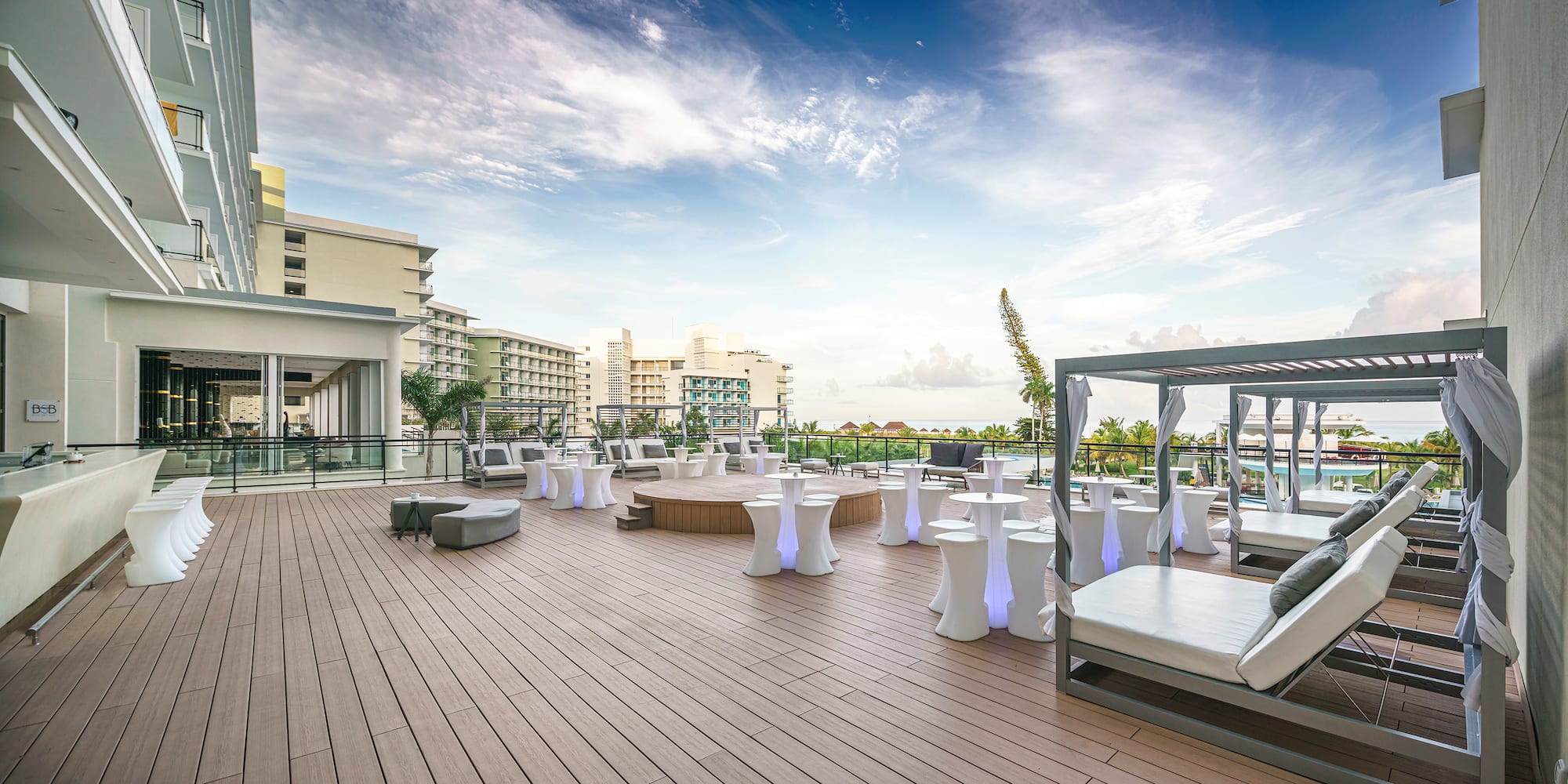 a deck with tables and chairs on it