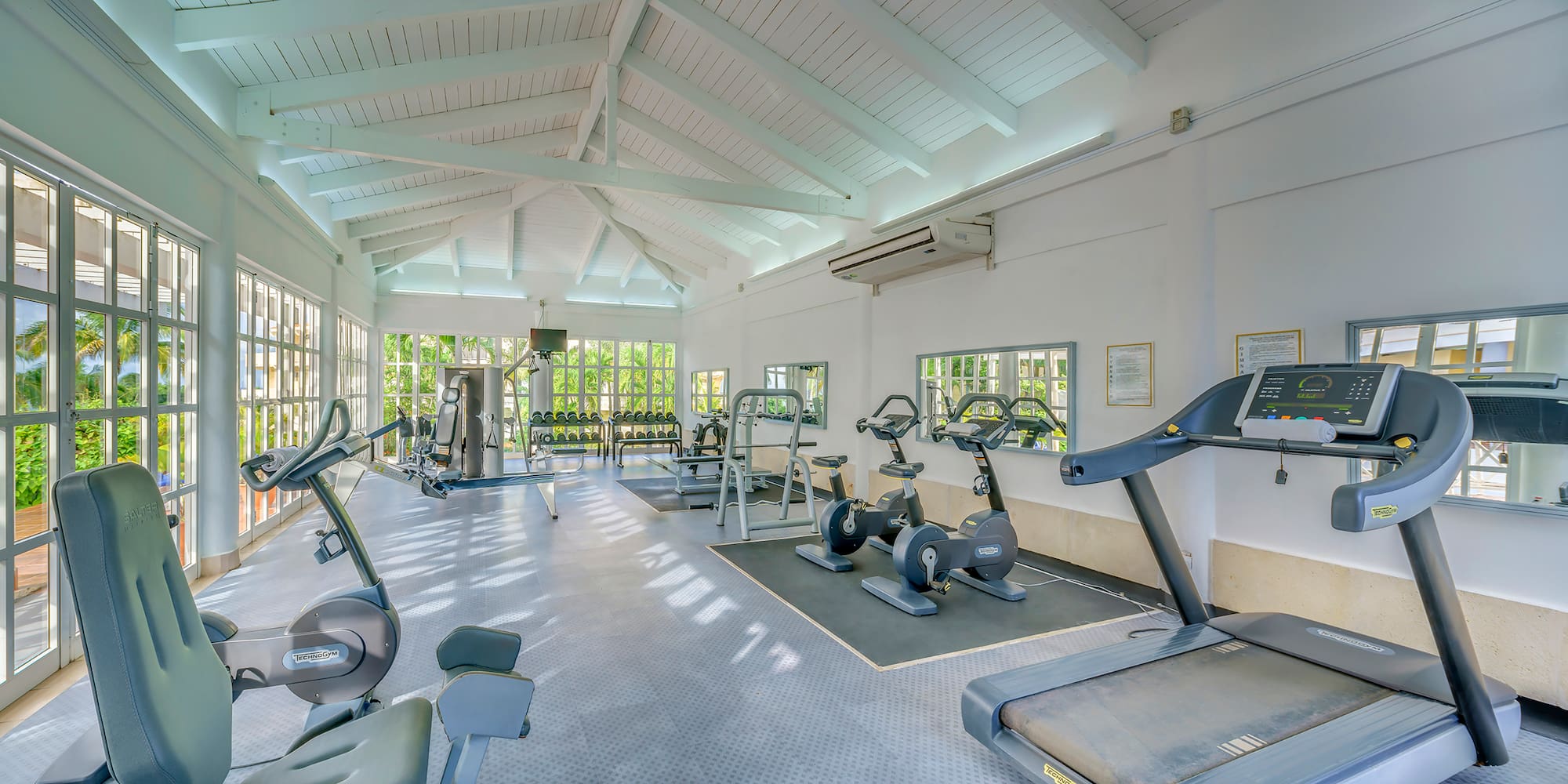 a large room with exercise equipment