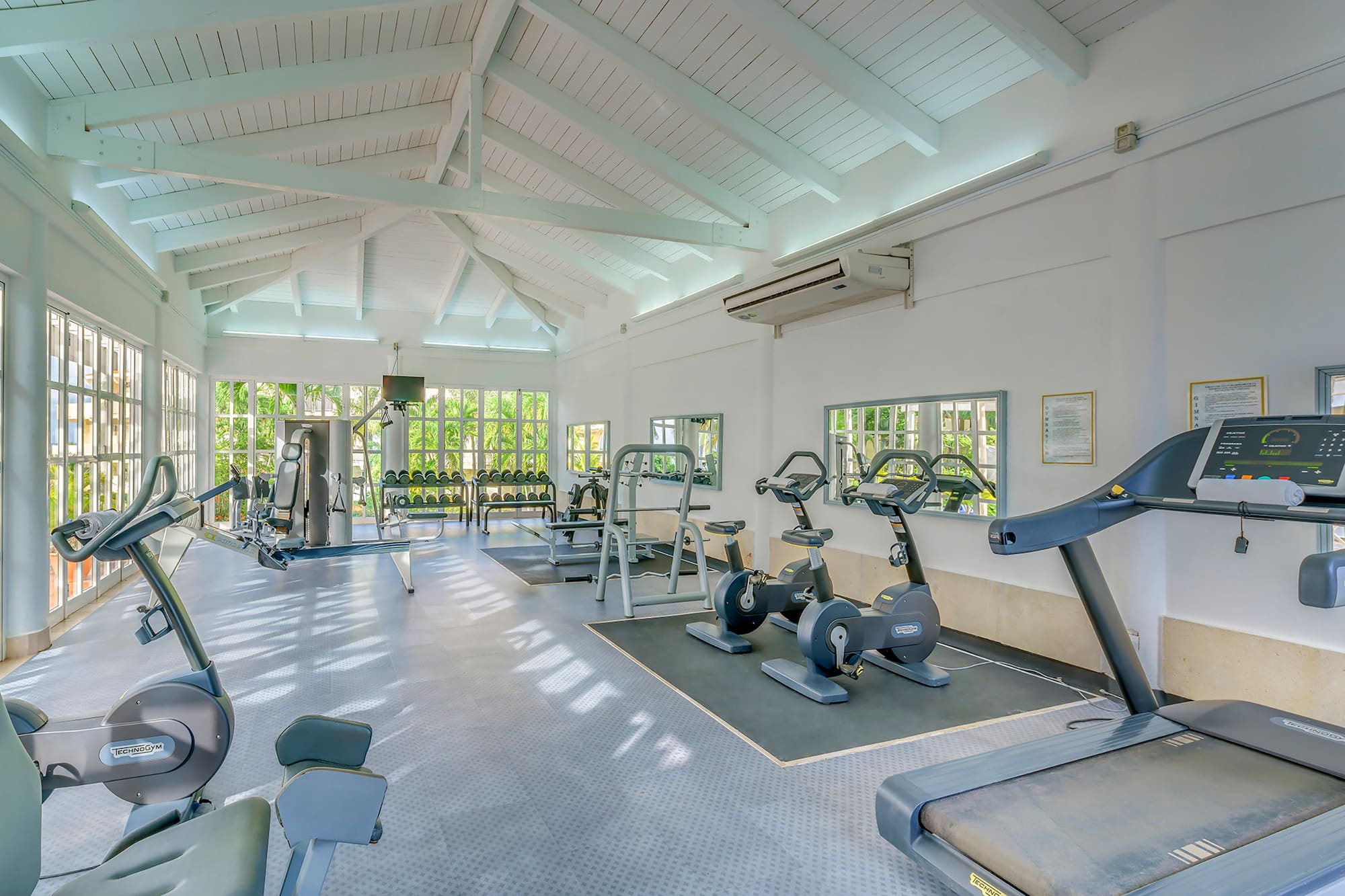 a large room with exercise equipment
