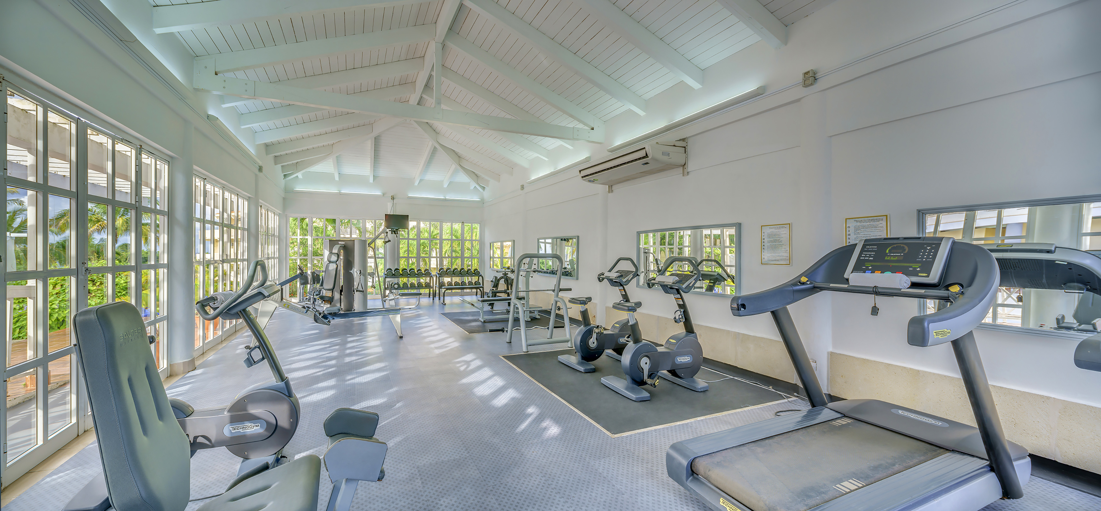 a large room with exercise equipment