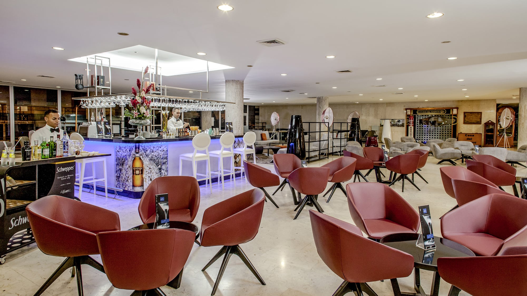 a room with chairs and tables