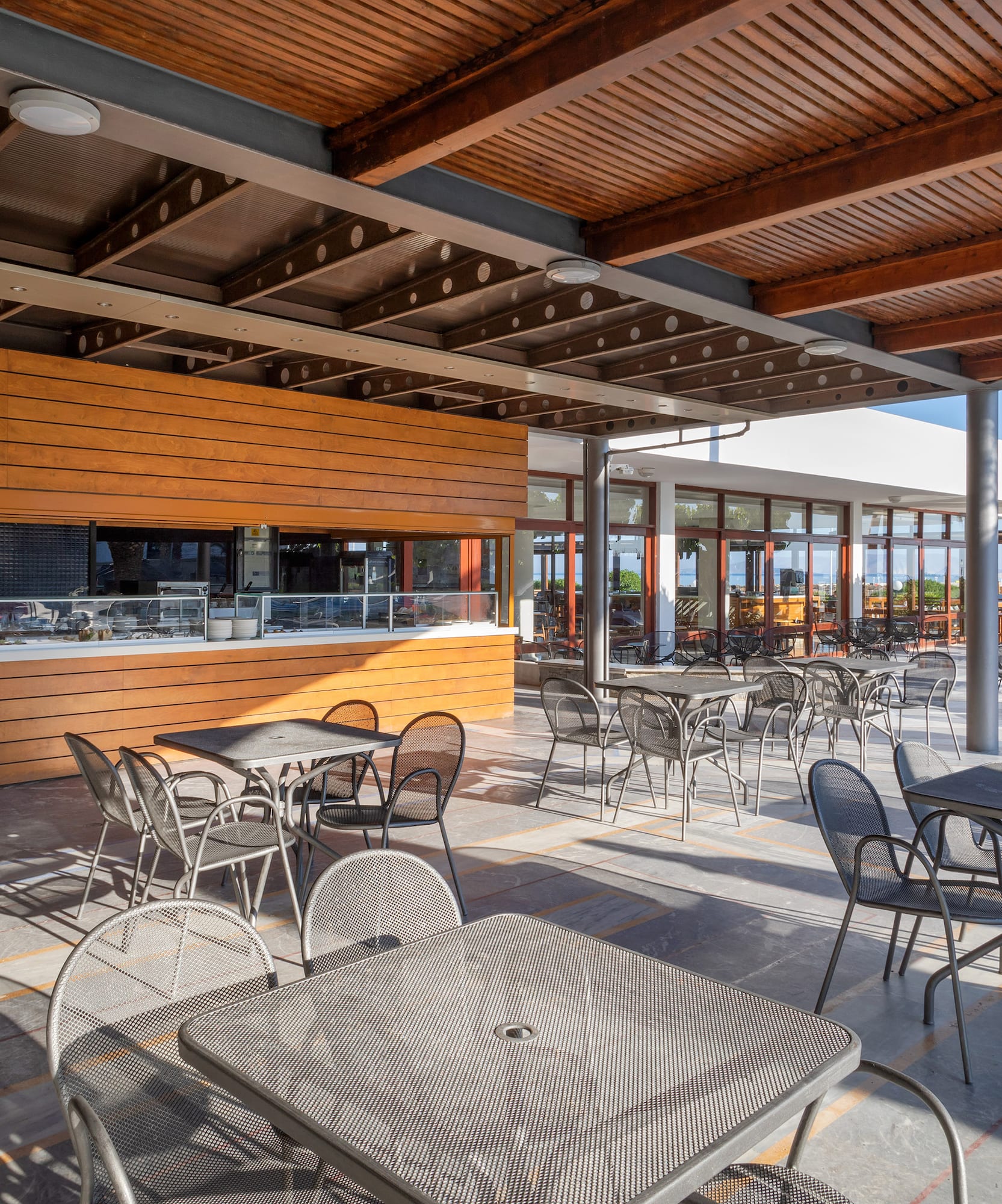 a patio with tables and chairs