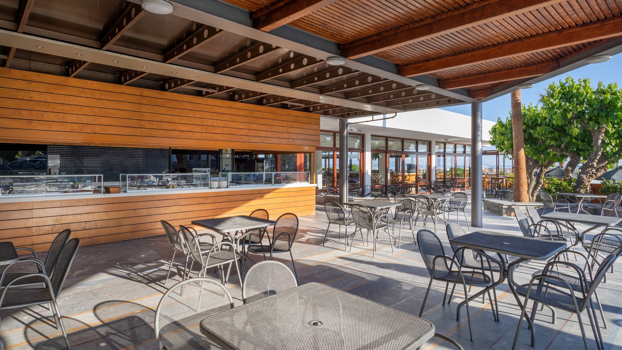a patio with tables and chairs