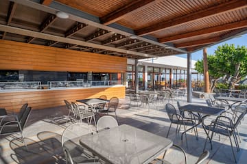 a patio with tables and chairs