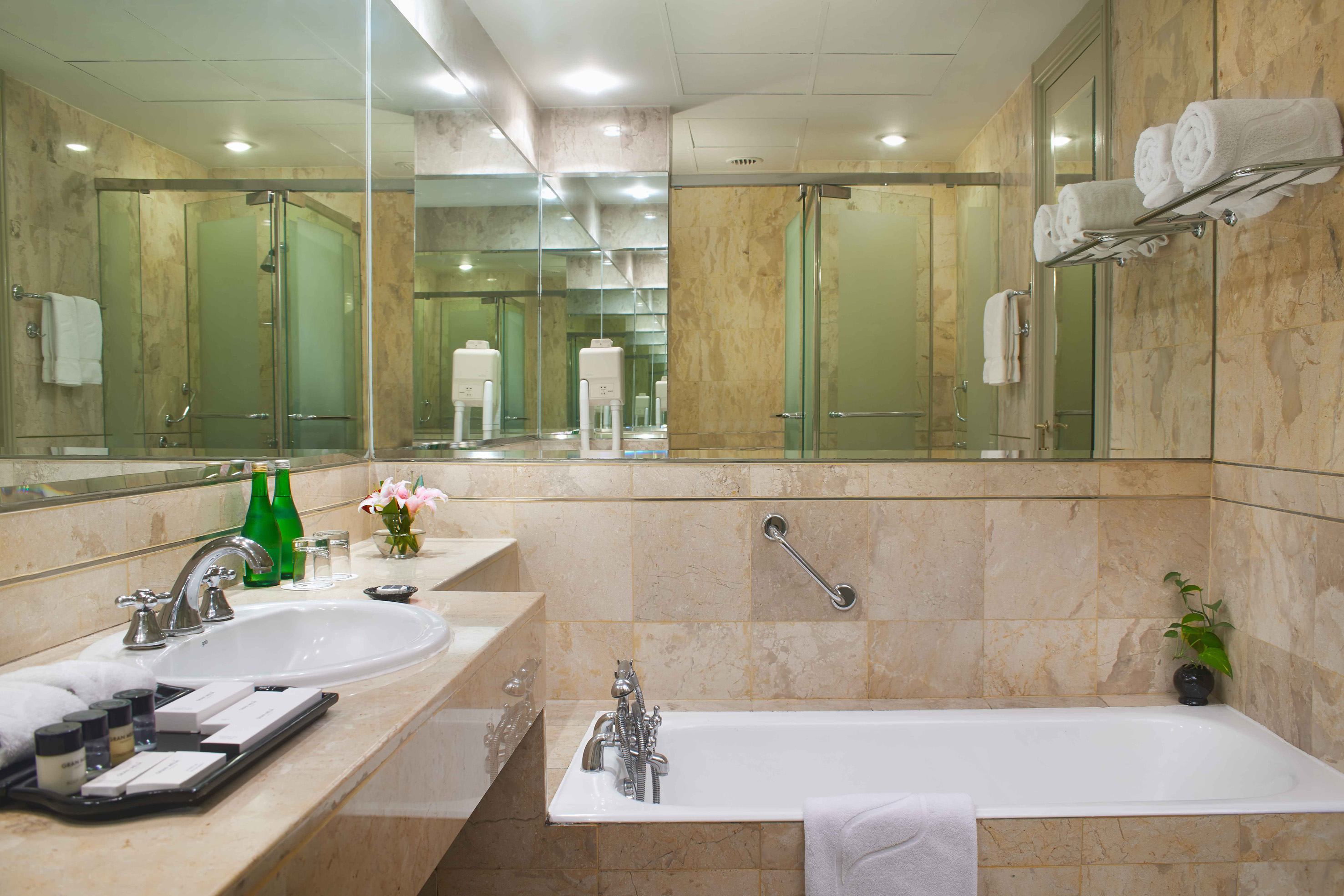 a bathroom with a bathtub and a mirror