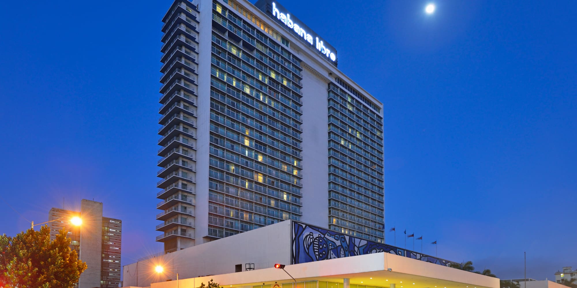 a large building with many windows with Hotel Tryp Habana Libre in the background