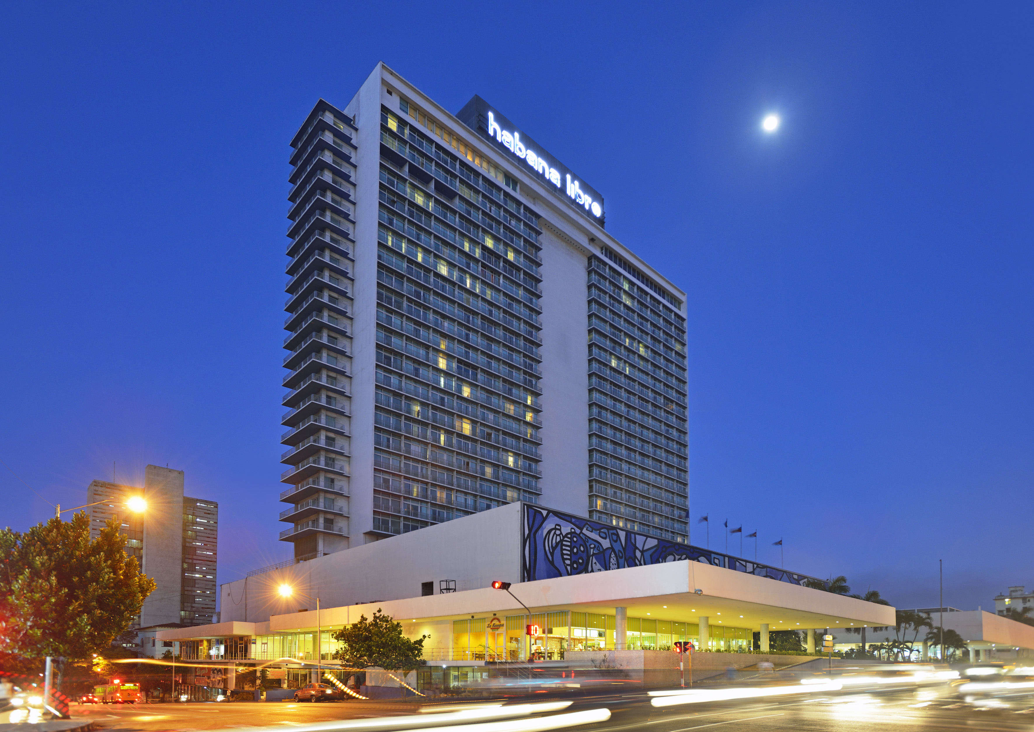 a large building with many windows with Hotel Tryp Habana Libre in the background