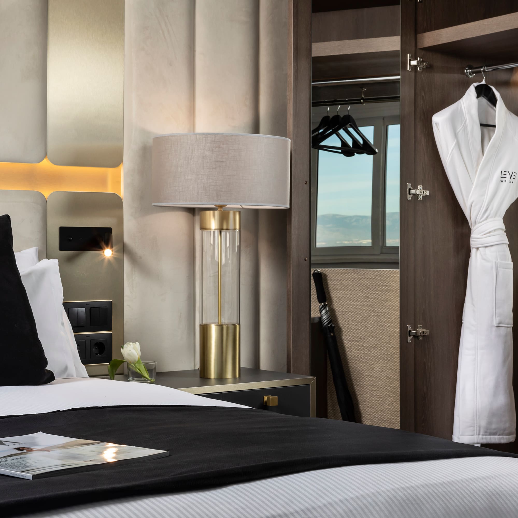 a room with a bed and a robe