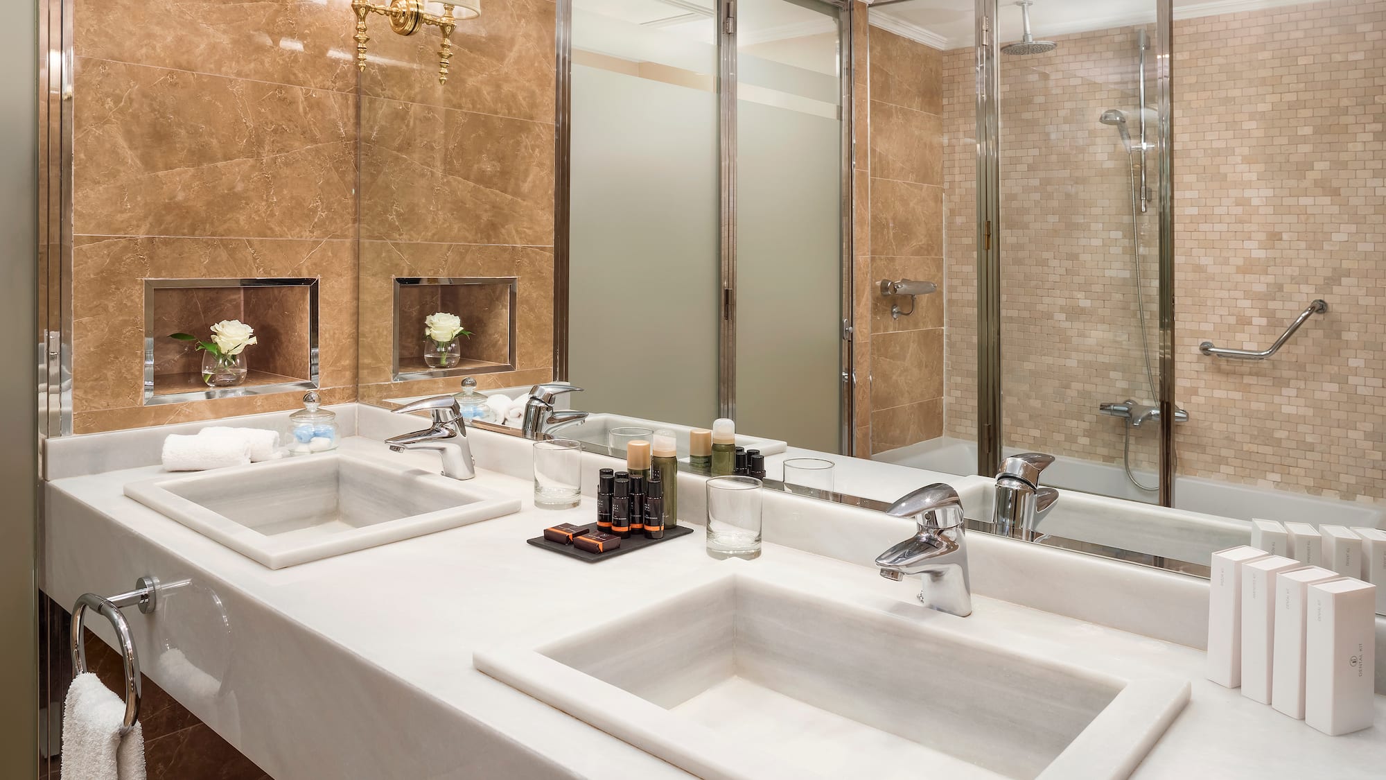 a bathroom with marble counter tops and sinks