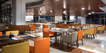 a restaurant with tables and chairs