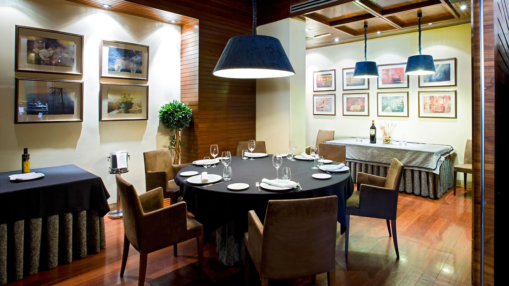 a room with a round table and chairs