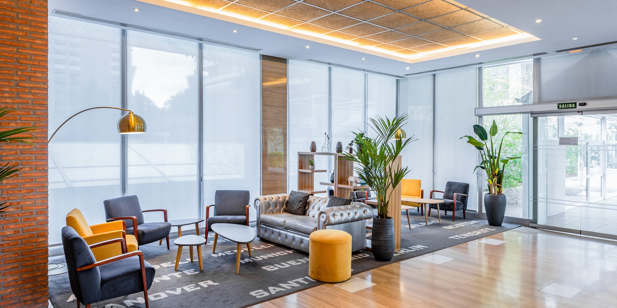 a room with a couch and chairs