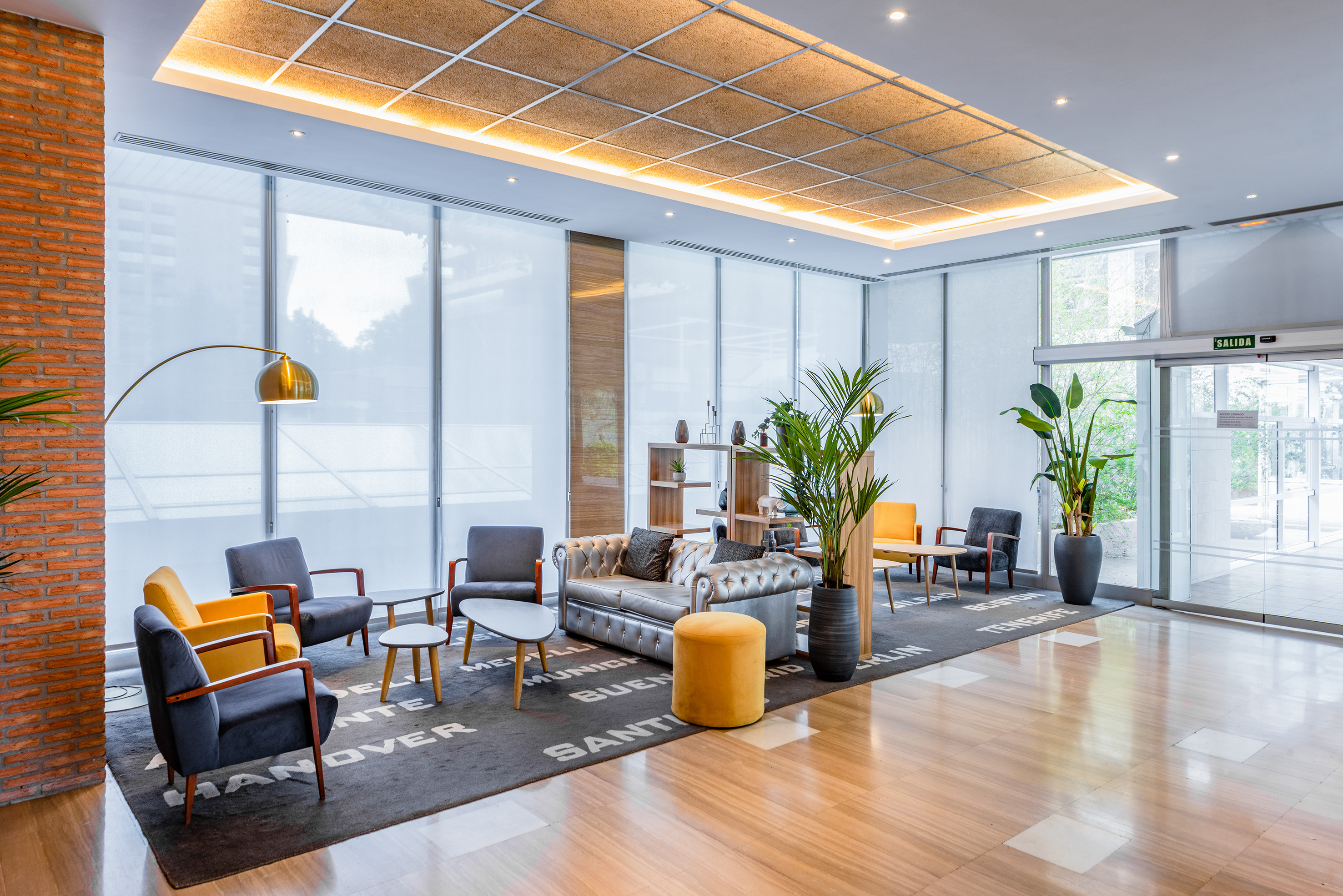 a room with a couch and chairs