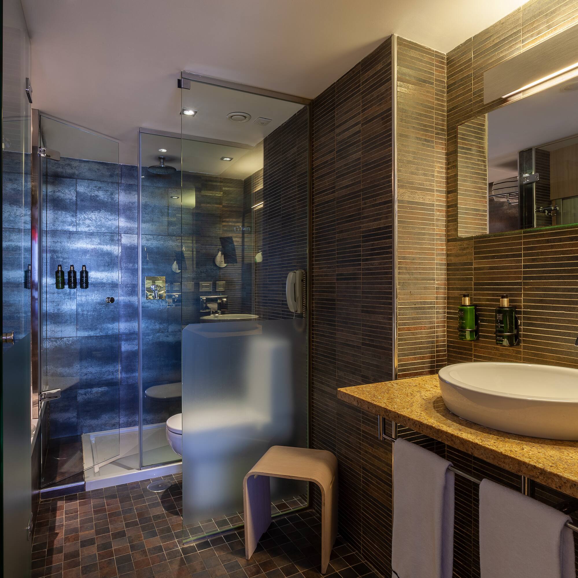 a bathroom with a sink and shower