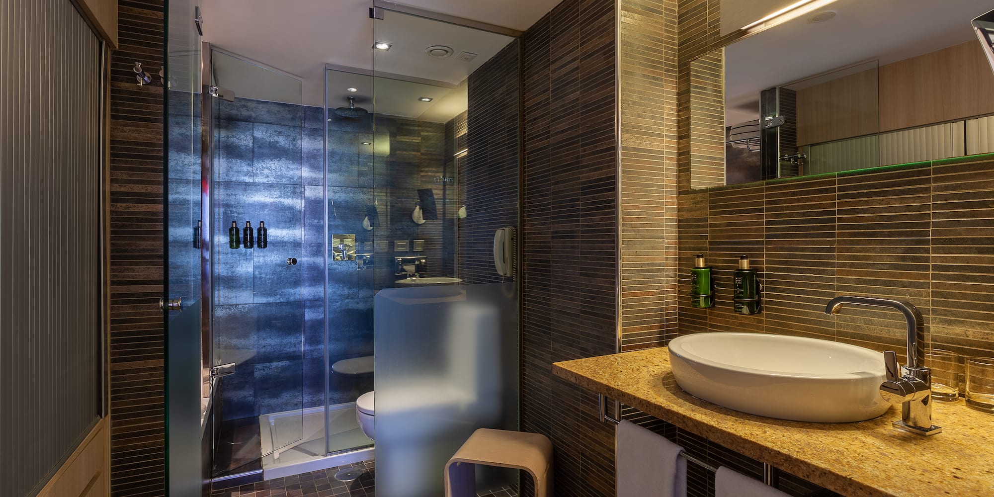 a bathroom with a sink and shower