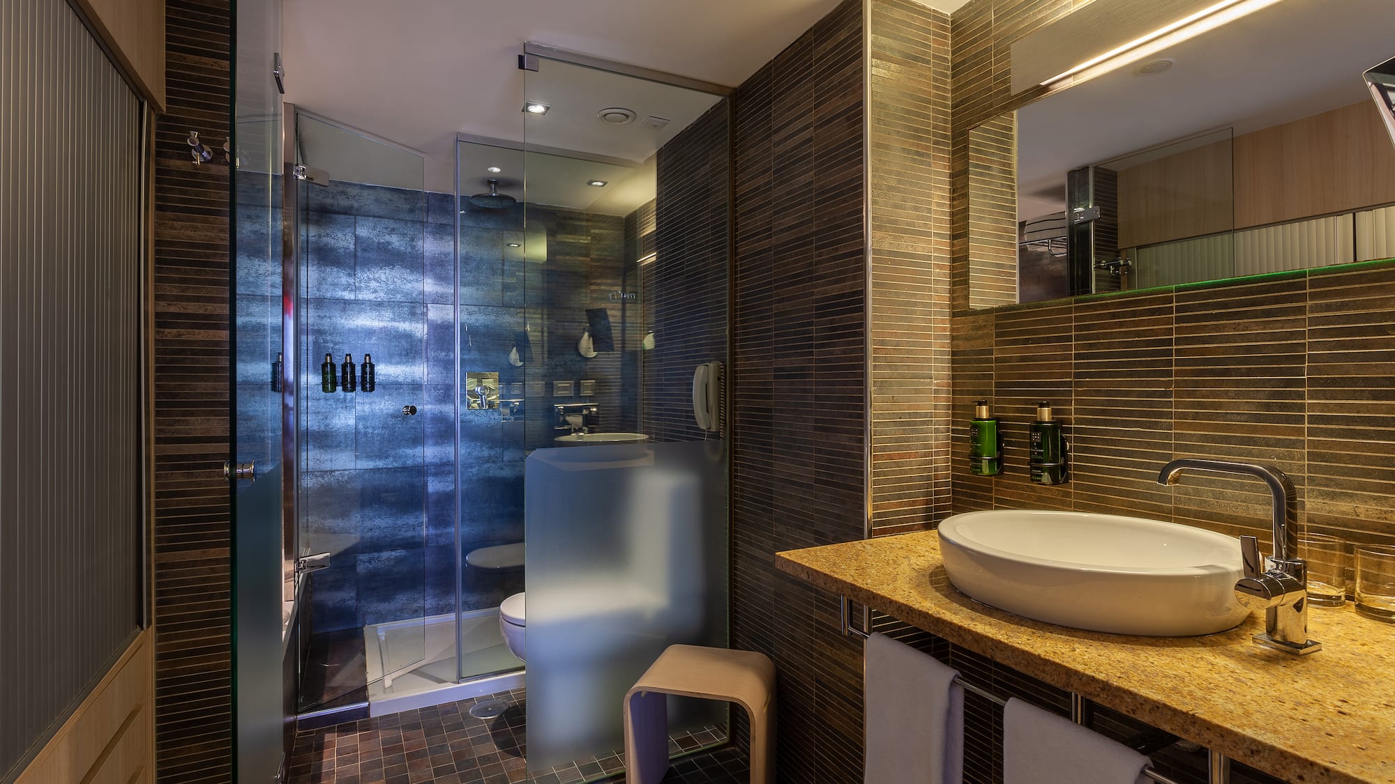 a bathroom with a sink and shower