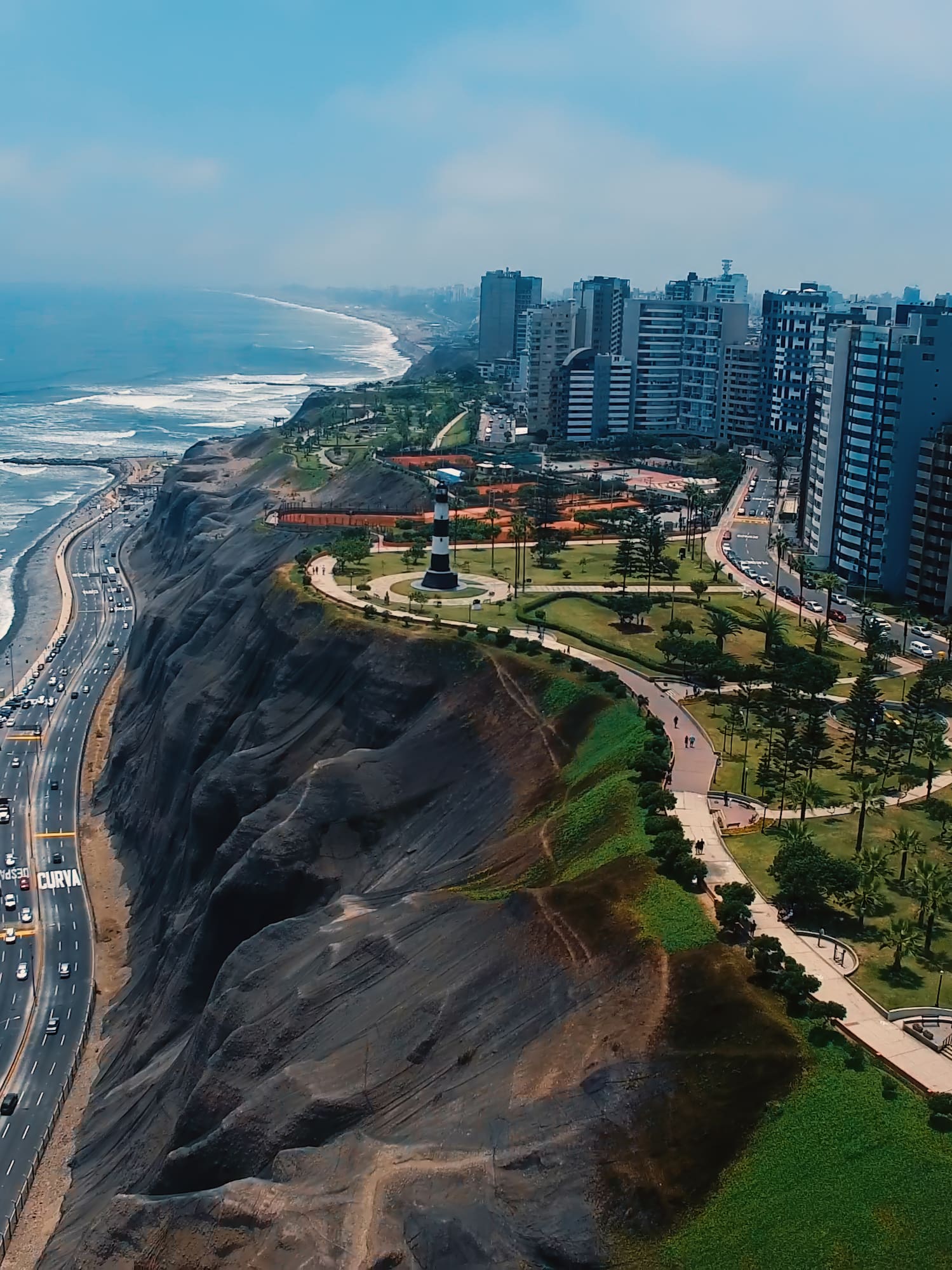 a city on a cliff by the ocean