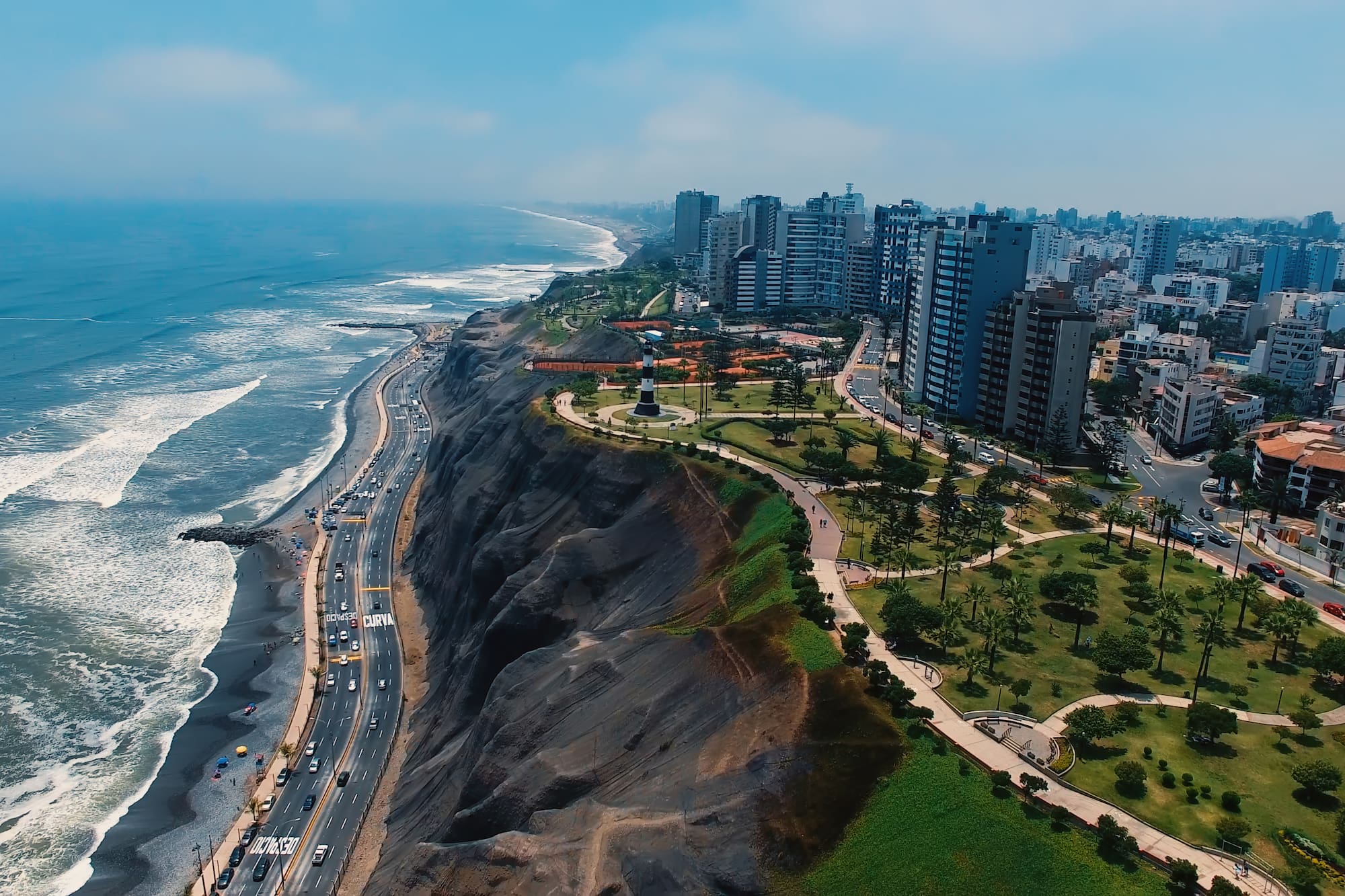 a city on a cliff by the ocean