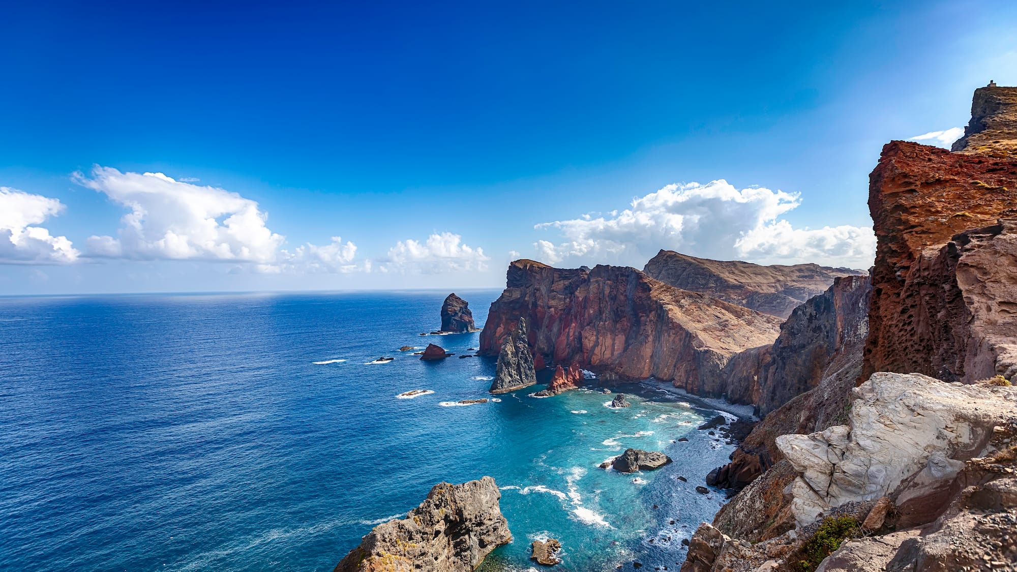 a rocky cliffs and water