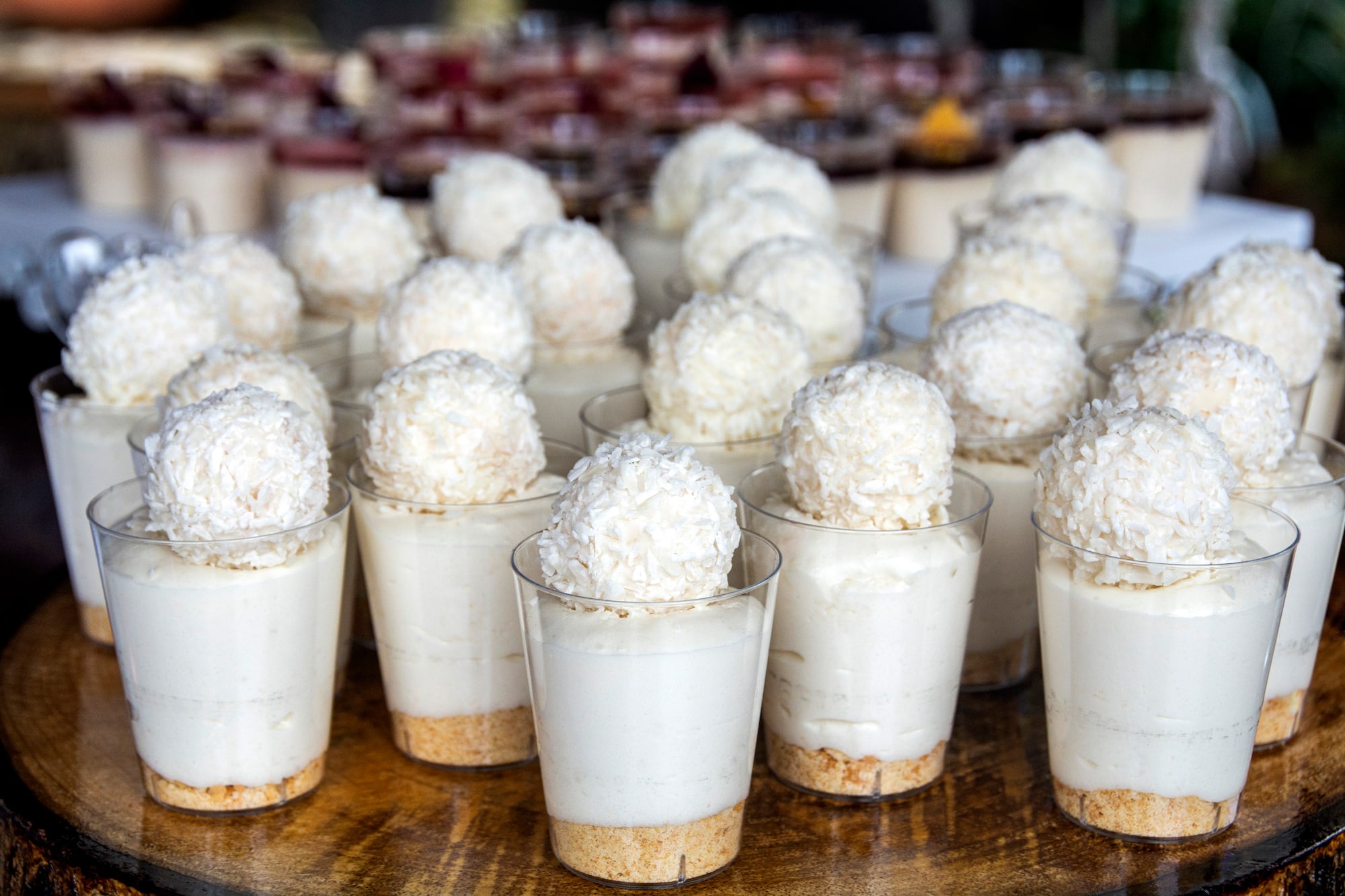 a group of desserts in plastic cups